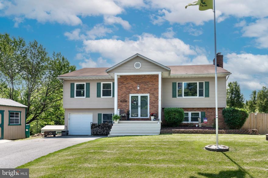 This oversized split foyer, located in the desirable Finksburg area, offers a blend of comfort and functionality. The property features three bedrooms and two full bathrooms on the main level, while the fully finished basement offers an additional large bedroom suite with bathroom, large closet, office, and family room with fireplace and bar area. Situated on a generous 0.65-acre corner lot, featuring well-maintained landscaping and an extra parking area for additional vehicles, boats, campers, etc.  Outdoor living is enhanced by a welcoming deck and porch, as well as a privacy fence in the back yard perfect for relaxing or entertaining. Additional structures include 4 storage sheds. This home offers tons of living space and versatility for todays buyers!