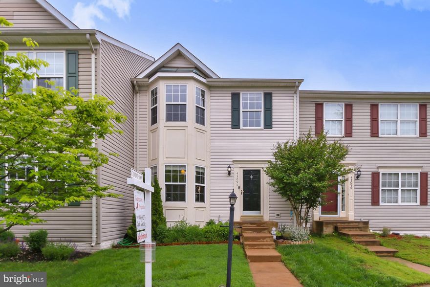 Perfectly nestled in the desirable Potomac Station community, this lovely 3 bedroom, 3.5 bath townhome delivers classic design sprinkled with contemporary flair. A tailored exterior, vibrant landscaping, custom deck, an open floor plan, hardwood flooring, decorative moldings and columns, and an abundance of windows are just some of the fine features that make this home so appealing.  Warm hardwood floors in the foyer welcome you home and usher you into the sunken living room where natural light creates a bright and airy atmosphere and a sliding glass door opens to the custom deck overlooking a paver patio and walkway, fenced-in yard, and common area beyond—seamlessly blending indoor and outdoor entertaining or simple relaxation. Back inside, the formal dining room provides space for all occasions and is accented by a chic and whimsical chandelier adding tailored distinction. The sparkling kitchen swith stainless steel appliances including a gas range and French door refrigerator, earth-toned flooring, dual pass-throughs, and pendant lighting, while the breakfast area harbors ample table space in front of a large bay window. A powder room with a pedestal sink complements the main level.   Upstairs, the primary suite features plush carpeting, a lighted ceiling fan, walk-in closet, and a private bath with spa-toned flooring and tub/shower surround. Down the hall, two additional bright and cheerful bedrooms, each with generous closet space and one with a bay window, share access to the well-appointed hall bath. The walkout lower level recreation room delivers space for games, media, and exercise, while a full bath and laundry/utility room complete the comfort and convenience of this wonderful home. Located in a great community filled with amenities such as an outdoor pool, tennis and basketball courts, community center, tot lots, and more. Commuters will appreciate its close proximity to Route 7, Route 15, and the Dulles Greenway; and everyone will enjoy the abundance of shopping, dining, and entertainment experiences right at your fingertips including the Premium Outlet Mall, Wegmans in the Village at Leesburg shopping center, and charming downtown Leesburg. For enduring quality in a vibrant location, you’ve found it. Welcome home!
