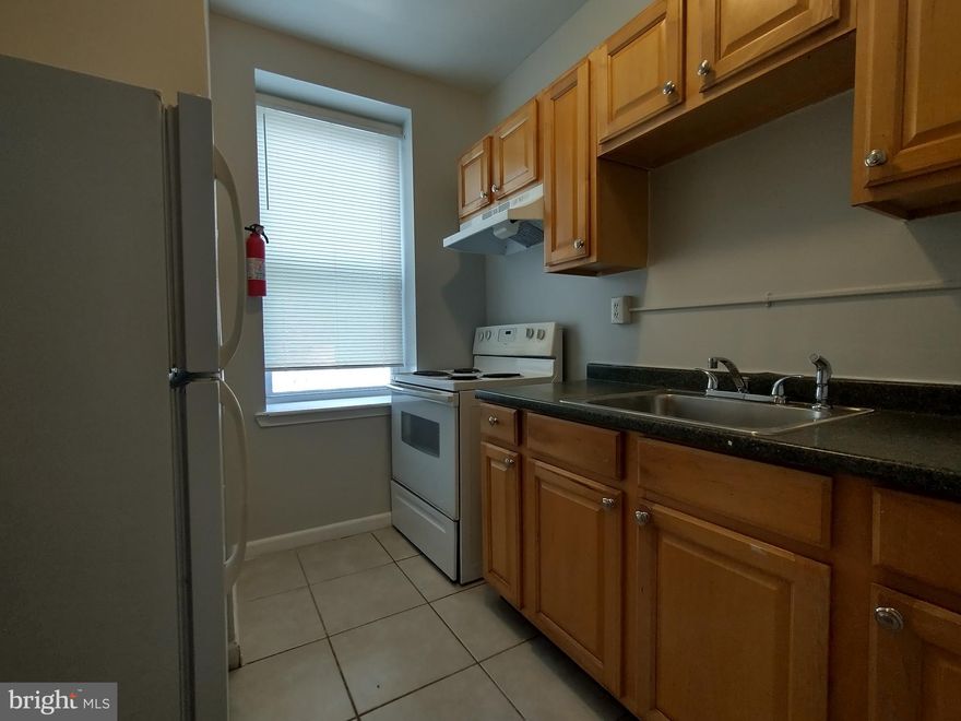 *One Month Free Rent* - 2-bedroom, 1-bath apartment. Perfectly suited for roommates, a small family, or anyone who wants a dedicated home office, this thoughtfully designed home features double coat closets, plush wall-to-wall carpeting, and oversized windows that bring in tons of natural light with relaxing courtyard views. The kitchen is equipped with a gas stove and full-sized fridge—ideal for everything from morning coffee to weekend meal prep. 

Enjoy central A/C to stay cool year-round, and elevator access makes coming and going a breeze. 

Secure keyless entry into the building. Amazon Hub for package deliveries! 
Utilities not included in rent. There is a flat monthly utility fee for water.  Residents must establish their own BGE account.

Hampton Court Apartments is a conveniently located mid-rise building in the Bolton Hill area of Midtown Baltimore City. Our professionally managed community offers a perfect mix of historic charm, affordability, and proximity to a variety of city amenities.

It's within walking distance of MICA, University of Baltimore, University of Maryland Medical Center, State Center, and Mount Vernon. You’ll enjoy hardwood floors, large windows, and high ceilings. Virtual tours are available. Students are welcome. Inquire today.

We are also close to the State Center Metro Subway stop, the Cultural Center Light Rail stop, Penn Station, and several bus stops.

Bus Routes: 53, 54, 73, 94, 154
CityLink Lines: Yellow, Lime, Pink