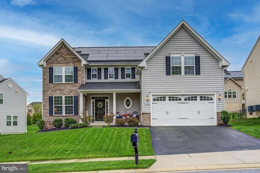 Luxury Living at Its Finest in Windlass Overlook!

Welcome to this meticulously maintained Luxury Colonial in the highly sought-after Windlass Overlook community! This stunning home is move-in ready and shows like a model, boasting high-end finishes and thoughtful upgrades throughout. With one of the largest floor plans in the neighborhood—offering over 5,000 total square feet and five spacious bedrooms on the upper level—this home provides exceptional space and comfort for any lifestyle.

Step onto the charming front portico porch and take in the serene, private view of the common grounds before entering the impressive two-story foyer. Inside, you'll immediately notice the brand-new laminate floors on the main level, enhancing the elegance of the open-concept layout.

The gourmet kitchen is a chef’s dream, featuring an oversized island, 42” white cabinetry, gleaming granite countertops, a stylish stone backsplash, stainless steel appliances, double ovens, and a spacious pantry. The kitchen flows seamlessly into the sunlit morning room with plantation shutters and inviting family room with a cozy gas fireplace, creating the perfect space for both everyday living and entertaining. A formal dining room provides an elegant setting for special gatherings, while a dedicated main-level office ensures a quiet space for remote work or study.

Upstairs, you will find brand new carpet, and the expansive Primary Suite is a true retreat, complete with dual walk-in closets and a large en-suite bathroom featuring a soaking tub, separate shower, and double vanities. Four additional generously sized bedrooms offer plenty of space for family and guests.

The fully finished basement, also with brand new carpet, is an entertainer’s dream, boasting a large wet bar with granite countertops, a spacious recreation area, a full bath, and a versatile bonus room—ideal for a home theater, game room, or play area.

Outside, the Trex deck provides the perfect setting for barbecues and gatherings, overlooking the beautifully maintained yard.

This Energy Star-rated home, built by Ryan Homes, includes energy-efficient lighting, HVAC, appliances, and a tankless water heater, offering modern comfort and efficiency. With the solar panels on the home you will enjoy the benefit of solar energy, allowing you a negative electric bill, that's right BGE pays you! And it also adds long-term value and eco-friendly appeal to your home.

Conveniently located near shopping, dining, and major commuter routes (I-95 & I-695), this home offers the perfect blend of luxury, functionality, and prime location.

Don't miss your opportunity to own this exceptional home—schedule your private showing today!