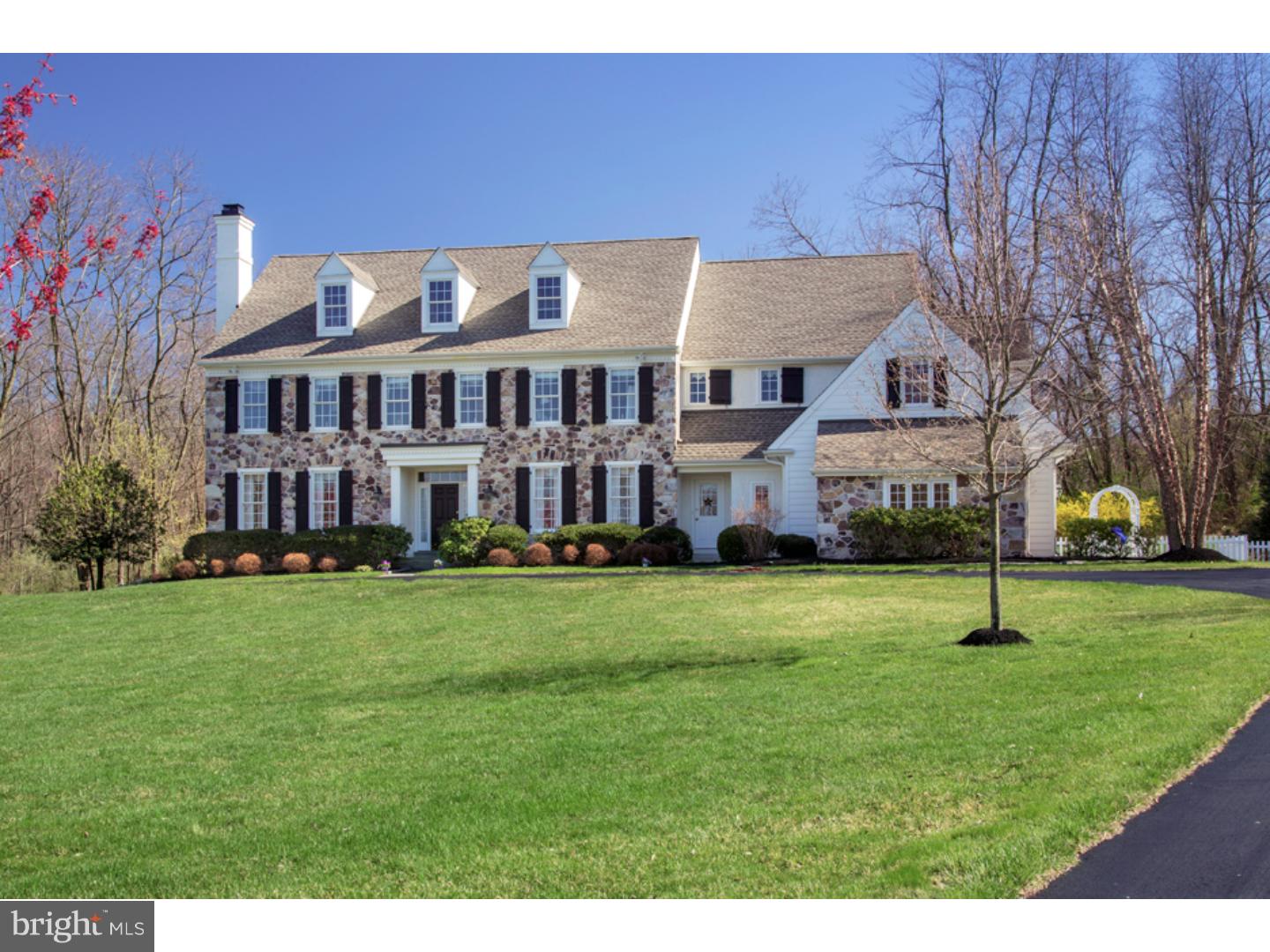 Warm, Welcoming, Elegantly-Designed Family Home in Malvern, on nearly 5 Sprawling Acres. You can't wait to come home to this inviting & expansive 5 BR luxury residence nestled on 4.7 lovely lush acres, half of which are wooded for extreme privacy. Mature flowering trees, beautiful plantings & newly-mulched beds grace the stretching outdoor surroundings which are perfectly picturesque. A newly-sealed circular drive & charming flagstone walkway greet your approach to this handsome 2-sty + basement home, distinguished by field stone, stucco & beaded siding & 3 classic roof dormers. Family & guests will love spending peaceful time outdoors on the private paver deck w/capped privacy walls & 2nd larger paver patio w/a built-in Zen-like pond & planting beds. An airy front-to-back foyer overlooking a wall of rear windows welcomes you into a bright & open ambiance complemented by abundant trim work, crown molding w/accent borders, hardwood floors & other exquisite details. Open doorways guide you into comfortable rooms, including a large LR w/a marble gas fp & decorative mantle?ideal for end-of-day relaxation & formal gatherings. Wainscoting, distinctive detailing & French doors lend sophistication to mealtime in the open-layout dining room. The chef will have plenty of prep room in the spacious gourmet kitchen highlighted by a huge double-sink center island w/seating, 6-burner Thermador cooktop, double stainless steel oven, built-in fridge w/a cabinet-style exterior, built in microwave & well-organized pantry closet. Sip coffee & daydream in the sun-drenched breakfast room overlooking the tranquil grounds through abundant glass. The window-surrounded FR w/a cathedral ceiling, plantation blinds, built-in seating & stone fp is a haven for unwinding or casual visits. Other highlights on the main level: a study w/extensive built-ins & decorative trim, mud area w/an additional kitchen storage closet, coat closet, 2nd PR & 3-car garage. A graceful oak hardwood staircase escorts you up to the open landing of the bedroom level. The Master suite has a sitting room, over-sized fitted walk-in closet + a private tile & hardwood bath w/double vanities & built-in seating. Additional BRs are well-sized. Across the hall from the laundry, you will find a seating area. The walk-out lower level is brightened by large windows & is a fun escape w/a game/TV room, workout room, wine closet w/glass door, wet bar w/cherry built-ins, granite top & wine fridge. Tax appeal pending.