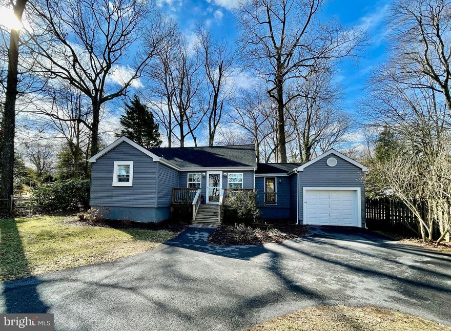 This beautifully renovated rancher with water views hosts a spacious yard, 1 car garage and is walking distance from the water! The entire home has been freshly re-painted. As you enter through the front door and you will notice the major modernization in this updated masterpiece that you can call home! This property features 3 bedrooms and 2 updated full baths. The kitchen is accompanied with  stainless steel appliances, granite countertops, LVT flooring and updated cabinets! There are large built in storage areas in the attic as well as a platform above the garage. There is a community beach nearby, perfect for volleyball, cookouts, and community events!