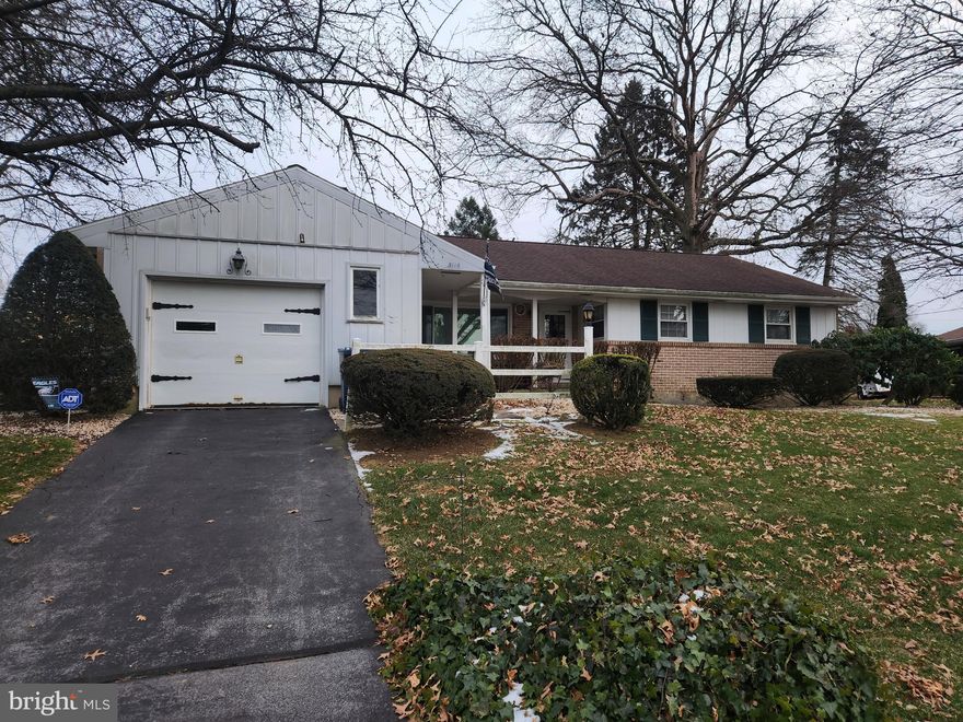 This property will be offered at Public Auction on Saturday, January 24, 2026 @ 11:00am.  The listing price is the opening bid only and in no way reflects the final sale price.  10% down due at auction, 2% transfer tax to be paid by the purchaser, real estate taxes prorated. This well-located ranch home, nestled in a quiet residential neighborhood, offers easy access to Route 422 and local amenities. The main floor of the home features a cozy living room with a wood burning fireplace, a formal dining area, an eat in kitchen as well as a convenient powder room and a family room. The floor continues with three bedrooms, a full bathroom and a spacious sun porch with vaulted ceilings and access to back patio. The partially finished basement provides additional living space, featuring another family room, a workshop area, a dedicated laundry area, and storage. Additional amenities include a home security system, an attached one car garage and an outdoor back patio, perfect for relaxing or hosting family & friends!