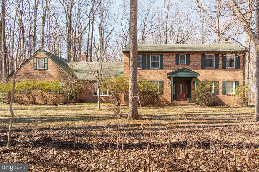 Spacious Brick Colonial on 3+ Acre Lot in Sagamore Forest II!   Amenities include 3, possibly 4, Bedrooms, 3 Full Baths, Large 2 Car Attached Garage with 2nd Floor Storage Room, Main Level Laundry/Mud Room, Eat-In Kitchen, Separate Dining Room w/Wood Burning FP, Finished LL with Recreation Room, Hardwood Floors and Enclosed Rear Patio.