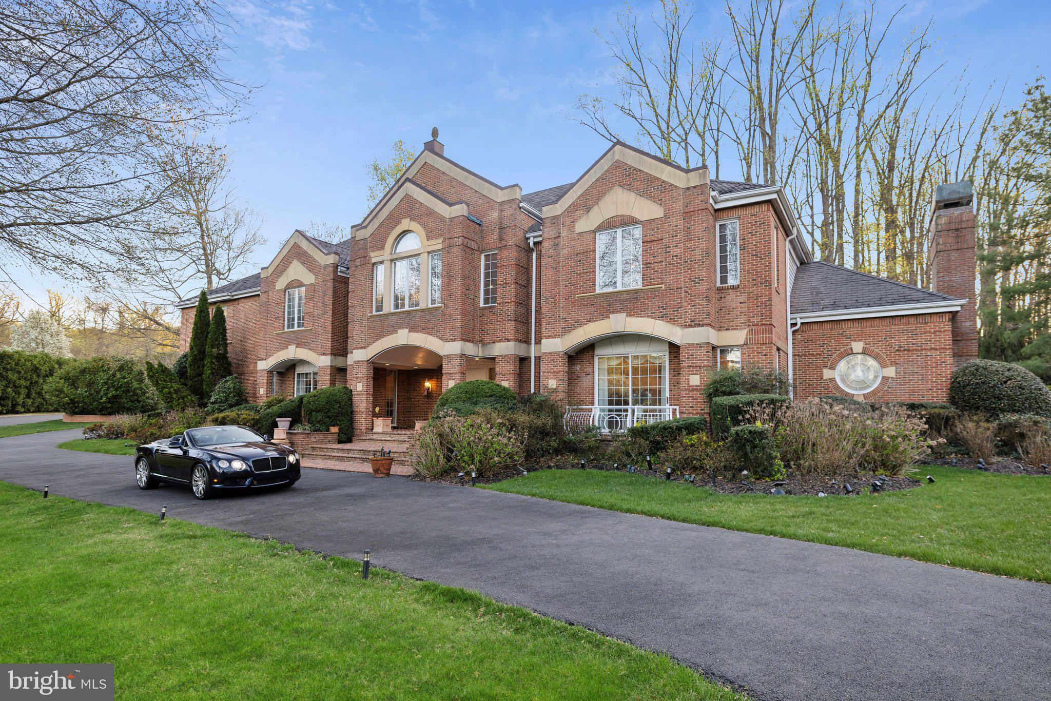 Great opportunity to own a very large, 13,352 sqft home under assessed value. Sited on a generous 0.83-acre private lot with multi-level brick and stone patios with pool. 7 bedrooms each with an en suite bath. Four-car garage, elevator, embassy-sized rooms, high ceilings. Excellent location close to Tysons, D.C., international airports, in sought-after Langley School District.