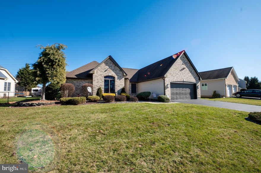 Enjoy first-floor living in this spacious Whitehall ranch. The open-concept areas provide a bright and welcoming home. The living room offers tall ceilings and a gas fireplace. Cabinets are abundant in the kitchen for storage and a tubular skylight provides natural light. A separate eating area looks out onto the covered patio and professionally landscaped yard and gardens. The dining room located off the kitchen makes entertaining a breeze. Down the hall are three bedrooms. The primary bedroom has a walk-in closet and ensuite bathroom with a separate sink area. Two additional bedrooms, currently being used as an office and extra TV room, are also on the first floor along with a shared hall bathroom with a whirlpool tub. Downstairs is a large family room with a half bath that has plumbing for a shower if desired. Two large closets provide additional storage along with the unfinished work area. A separate room, currently used as a gym, is off the family room and can also be used as an office or a potential 4th bedroom. Additional amenities include the first-floor laundry/mudroom, security system, and wiring for surround sound. The two-car garage is tiled with a built-in shed/storage area. Convenient to shopping, restaurants, and major highways.