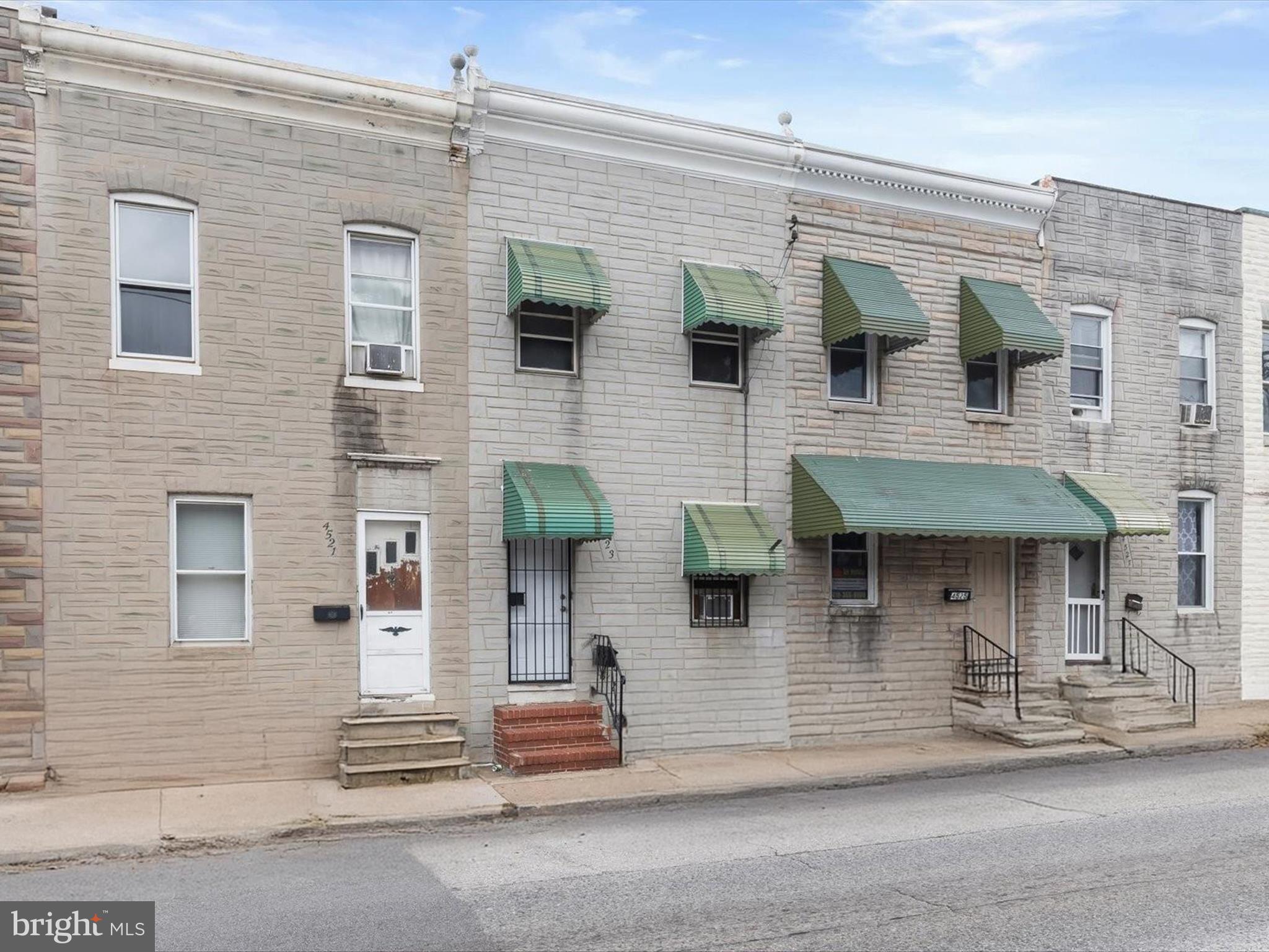 This three-level row home offers two bedrooms and two full bathrooms, blending comfort and functionality throughout. The inviting front living room features recessed lighting, while the eat-in kitchen includes gas cooking, a pantry, and space for a dining table. A versatile bonus room sits just off the kitchen, providing flexibility for your needs. Upstairs, both bedrooms have ceiling fans, and the updated full bath features a tiled tub/shower. The finished lower level expands the living space with a spacious recreation room, an additional bonus room, and a second full bath with a walk-in shower. Outdoors, enjoy a large fenced rear patio, perfect for relaxing or entertaining. Conveniently located in Curtis Bay, this home is just minutes from major routes for an easy commute. Some images have been virtually staged. Sold As-Is.