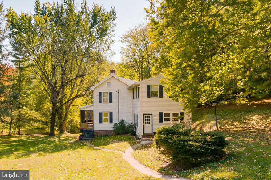 Have a seat in a chair on this farmhouse style home nestled on over 2 acres of land, with your own stream running  through the property. Plenty of space to explore and enjoy. Property has been the backdrop for many milestone pictures, and celebrations for the owners.    You'll find four bedrooms on the upper level and two full baths, along with the laundry room.   On the main level, you'll find a large family room, dining/office,  living room, half bath and additional storage.   Multiple heat sources options - using oil, electric and wood.  Detached garage has electricity, and perfect for projects or workshop.   Well pump was replaced 12/19 and the septic pump was replaced 9/20.   Make memories of a lifetime on this property and nearby at Baugher's Farm and Orchard, parks, reservoir.  Minutes from the heart of  Westminster.  Check out 100 percent financing options with USDA.  As-is, yet well taken care of.