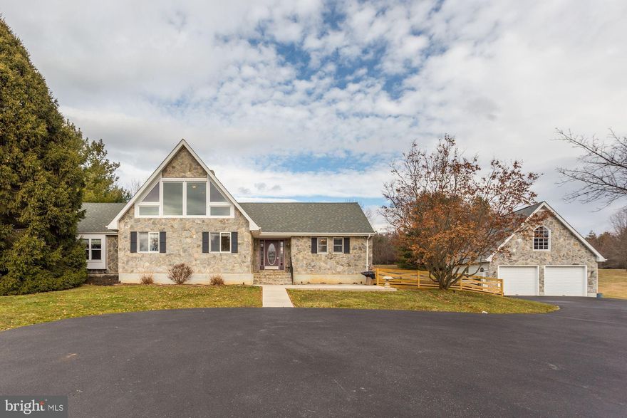 Beautiful rancher that's been meticulously maintained and is full of upgrades. Soaring ceilings in two-story family room with stone-faced gas fireplace, which opens into dining room and kitchen with granite countertops and custom cabinets. All doors throughout home are solid (not hollow-core), enormous windows in loft overlooking family room. Downstairs has media room, already wired for your screens and speakers, a recreation room with rough-in for a wet bar, and an office with two closets. Two car attached garage, with huge three-car detached garaged with insulated walls and doors, and a full second story that could be transformed into a separate apartment, or a workshop. High efficiency heat-pump hot water heater. Outside, the fenced rear yard has extensive hardscaping, including a large patio, and is beautifully landscaped, with 3.3 immaculately maintained acres. Fantastic home for entertaining, both indoors and out! See this one today, fantastic opportunity to own a home that's got privacy and seclusion but is just minutes from town and only 30 to 40 minutes to Leesburg, Winchester, and Frederick. Security cameras and security system convey.