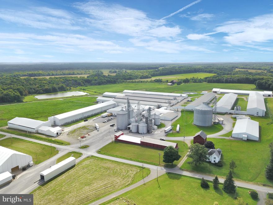 Egg Operation: (2) 56' x 426' layer barns, capacity of 160,272 per barn.  (2) 68' x 528' layer barns, capacity of 120,129 per barn; (1) 77' x 488' layer barn, capacity of 155,200; (1) 77' x 342' layer barn, capacity of 241,056; (1) 61' x 402.5' layer barn, capacity of 241,920; (1) 56' x 512 layer barn, capacity of 97,728; (3) pullet houses with a total capacity of 500,000; Bio-secure (40 miles to closest poultry house).  Feed Mill: Feed mill with 30 ton/hour mixer; 550,000-bushel total corn storage; (7) 50-ton bins; (8) 25-ton bins; (1) 20-ton load out bin; (2) 15-ton heated soy oil metered tanks; (1) 7-ton methionine heated metered tank; (1) 30-ton dical bin; (1) 25-ton salt bin; (14) micro feed bins.  Egg Processing Facility: New egg processing facility built in 2016; Moba PX530 grader; 530-case-per-hour capability; over 10,000 square feet of cold storage; 25,000 square feet of dry storage; SQF certified.  Manure/Waste: 140' x 420' in vessel compost manure facility; processing wastewater storage (1 million gallon); 100' x 200' x 54' dry manure storage; 30' x 40' fully automated truck wash; CAFO permits; odor management permits; manure sold for profit.  Miscellaneous: 100' x 200' x 52' storage shed, set up to store manure or grain; 7 wells; 3-acre, 7 million gallon reservoir that is chlorinated, softened, and UV treated; 360 tillable acres; 767.75 total acres; 9 residences; well below appraised value.