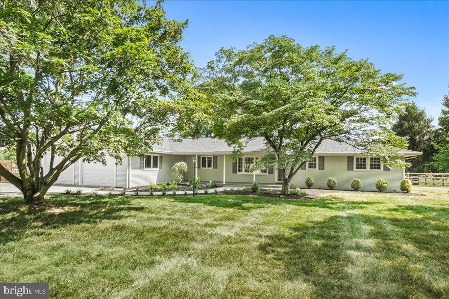 Welcome to 2319 E. Mayberry Road, a beautifully updated 3-bedroom, 3-bathroom ranch-style home nestled on a spacious 0.92-acre lot in picturesque Westminster. This home boasts gleaming hardwood floors on the main level and elegant tile on the lower level, offering both comfort and style. The expansive sunroom with panoramic views of the lush backyard and serene pond is perfect for relaxing or entertaining guests.
As you enter, you are greeted by a cozy living room featuring a charming brick fireplace, ideal for warming up on chilly evenings. The kitchen is a chef’s delight with quartz countertops, stainless steel appliances, and ample cabinetry. Adjacent to the kitchen, the dining area flows seamlessly into the sunroom, creating an open and airy feel.
The fully finished lower level offers additional living space with a second fireplace, perfect for a family room or home office. Accessibility features include a chairlift and mobility improvements, ensuring convenience for all residents. The property also includes an attached 2-car garage with ample storage space.
Step outside to discover a beautifully landscaped yard with mature trees, a private patio, and a delightful pond, providing a peaceful retreat. This home is perfect for those who love outdoor living and appreciate nature’s beauty.
Located approximately 15 minutes from Taneytown, Westminster and Littlestown. With local schools, shopping, and dining, this home offers the perfect blend of country charm and modern convenience. Don’t miss the opportunity to make this your dream home!