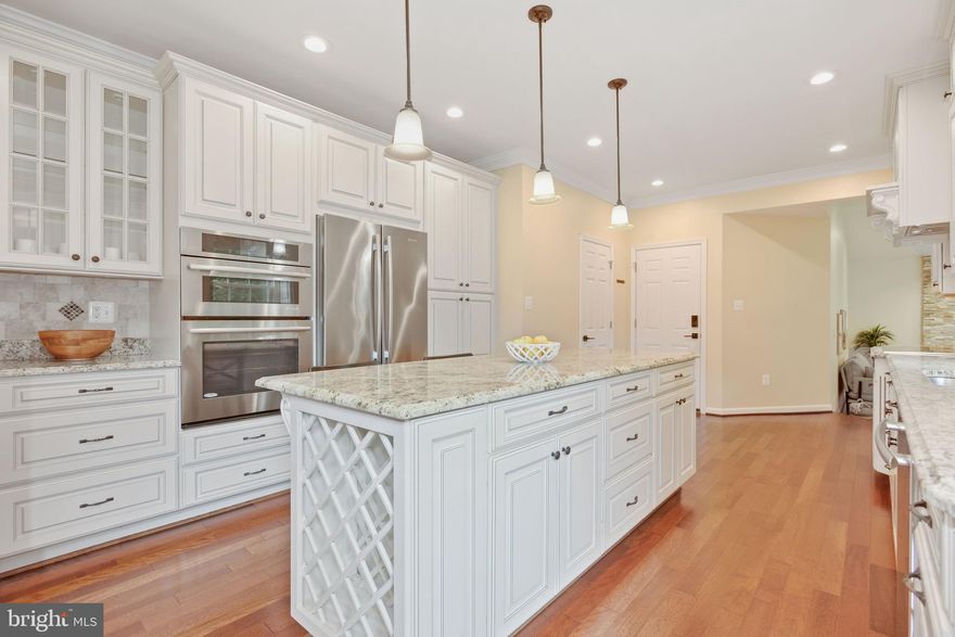 Beautiful move-in ready home in highly sought-after Fairfax Station neighborhood! Open floor plan with gleaming hardwood floors on the first and second levels. Stunning gourmet kitchen with granite counters, large center island, stainless steel appliances and high-end cabinetry.  Family room with vaulted ceiling, Palladian windows, and upgraded stack stone fireplace. Light filled living room and dining room. Dining room has bay windows.  Main level library with French doors and built-in cabinetry. Renovated half bath. Updated staircase leading to second level; Spacious primary bedroom with cathedral ceiling, walk-in closet and two addition closets. Renovated primary bathroom with ceramic tiles, dual sink vanity, granite counter, separate soaking tub, and a large walk-in shower with frameless glass doors. Three additional bedrooms each with a spacious closet. Renovated second bathroom with skylight, dual sink vanity with granite counter. Finished basement with rec room, game room, exercise room, large full bathroom and a workshop. Beautifully landscaped corner lot property. Newer systems, roof and windows.  The Fairfax County trail system is accessible from several locations throughout the community. Paved biking, walking and jogging access to Lake Mercer, Burke Lake, and South Run Rec Center. Nearby shopping, dining, and entertainment. Minutes to I-95, 123, Fairfax County Parkway, VRE, and Springfield Metro. Expected on the market 9/15