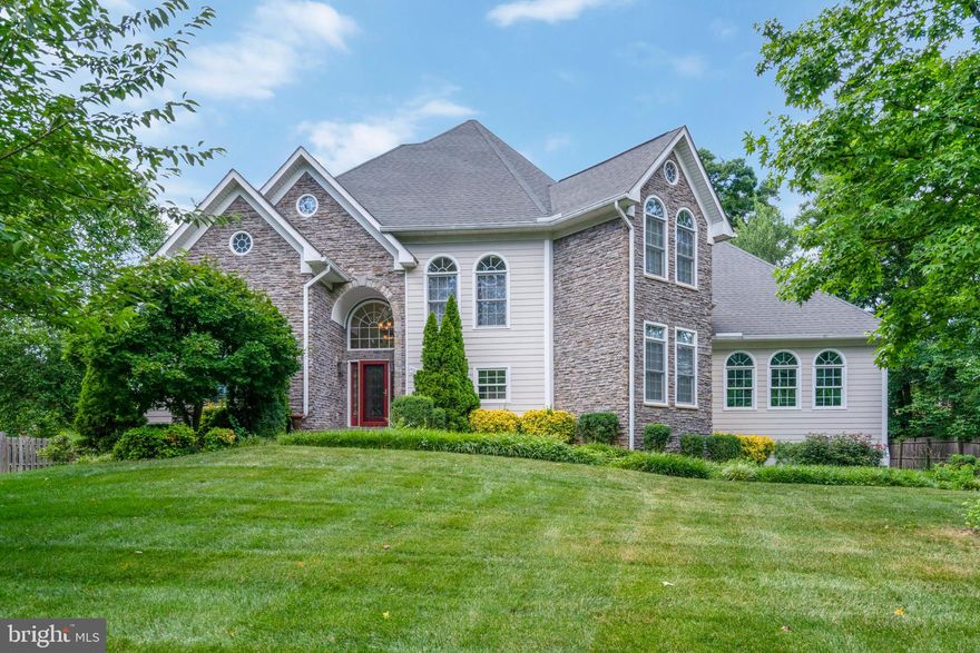 Enjoy the quiet and privacy of this non-subdivision Custom built home sited on a beautiful 1/2 acre landscaped lot.  Conveniently located and just minutes to shopping and transportation.  Walk to Metro Bus & connector to Van Dorn Metro, 1 mile to I-395, I-95 & Beltway,  20 minutes to Pentagon/DC.
Main level Owners retreat with Spa bath and walk in closet with custom closet organizers, Main level office, Family room w/built in bookcases and double sided fireplace shared with formal living room w/coffered ceiling, Formal dining room, 9,10 & 12' ft ceilings and custom features throughout.  Fully equipped kitchen w/pantry, separate breakfast room, main level laundry room, hardwood and marble floors, Plantation shutters and custom window treatments completes the main level.  Graceful staircase to upper level features 3 guest bedrooms all with walk in closets, 2 bathrooms, 2nd family/game room, finished storage room  off 3rd bedroom.  Upper level walk in linen closet is plumbed for a future laundry room.  Lower level ideal for large family or in law suite,  huge recreation room w/2nd fireplace and custom built wet bar, media room or 2nd office, 5th bedroom, full bath and large storage room.  Exterior irrigation/sprinkler system, New Aprilaire humidifier and Hot Water heater installed Nov. 2023,  Driveway resurfaced May 2024, Motor replaced in Zone 1 & transformer & mother board replaced in zone 2 of HVAC August 2024, Seamless gutters and 40 year roof, Stereo system speakers throughout main level except kitchen, breakfast room, and bathrooms.. Artwork in living room & mirror in dining room, safe in master closet conveys.  Electronic air cleaner as-is, refrigerator icemaker not connected...Please excuse clutter in garage