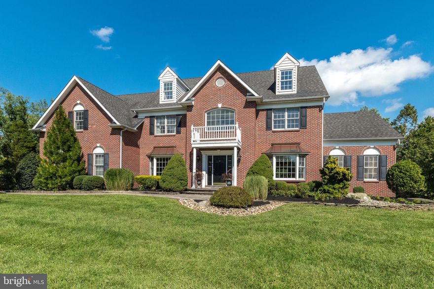 Welcome to 2317 Baldwin Ln with striking brick front setting the tone for the classic elegance that awaits inside this 5 bedroom 4.5-bath estate home offering a blend of grandeur, comfort, and natural beauty that is sure to impress. Step into luxury as you enter this exquisite home through a grand formal front foyer with the dedicated owner's office to the left offering a private and productive workspace and the formal living room to the right, adjacent to the formal dining room, designed for sophisticated entertaining, providing a graceful setting for special occasions and gatherings and are complimented by adjoining conservatory with cathedral ceiling for additional space for family and guests to gather - be sure to take in the adornment of crown and chair rail mouldings throughout these lovely spaces. Continuing on to the back of this stunning home is the spacious gourmet kitchen that's a chef's dream come true. It's equipped with cherry cabinets, granite counters, gas cooking, double oven, and offers ample counter space and a double pantry to accomodate all of your culinary adventures. The breakfast room is a perfect place to start your day, with access to a beautiful composite deck for dining alfresco with a view. The two-story family room bathed in natural light is the heart of the home, featuring a cozy gas fireplace and a wall of windows that frame picturesque wooded views. It's a welcoming space for relaxation and gatherings and has a convenient second staircase to the upstairs bedrooms. Completing the main floor is the powder room, with convenient central location, and an updated mudroom, as you come in through the garage, with built-in shelving and coat storage. Upstairs you will find the primary suite - a true retreat, featuring a cathedral ceiling, a generously sized sitting room, large walk-in closet, and a newer master bath that exudes luxury and relaxation with added spa like features such as an extra large shower, double vanity with additional cabinetry storage, heated towel rack, and heated floor - the perfect escape after a long day. Two of the 4 upstairs bedrooms, both with walk-in closets, share an oversized Jack and Jill bathroom with a large linen closet providing convenience and functionality. Completing the 2nd level is the en suite bedroom offering comfort and privacy for family or guests. Finishing the tour brings you to an entertainment haven in the walk-out finished basement, complete with a full bath, bar area, theater room/5th bedroom with surround sound, multiple recreation spaces and exits out to a beautiful blue stone patio complete with a fire pit and stairs to the driveway making it easy for guests to access for those backyard celebrations. This estate home is situated on arguably the most private level lot in Warick Lea which backs to gorgeous Warwick Twp woods and is next to the paved neighborhood trail giving you the ability to enjoy the tranquility and privacy of your surroundings while still being part of a vibrant community. The sellers made a few structural changes when building their home: the addition of the conservatory which includes basement space below, and a 2 foot bump out to enlarge the kitchen, dining, and 2 bedrooms and Jack 'n Jill bath above the kitchen and dining. This home combines luxurious features with practical amenities to create a comfortable and stylish living experience and is conveniently located with easy access to NYC and Philadelphia, a variety of wonderful restaurants and shopping in Doylestown Boro and beyond, and a short drive to the country for apple picking and outdoor fun. Welcome home! Listing agent to guide all tours - don't wait to make your appointment!