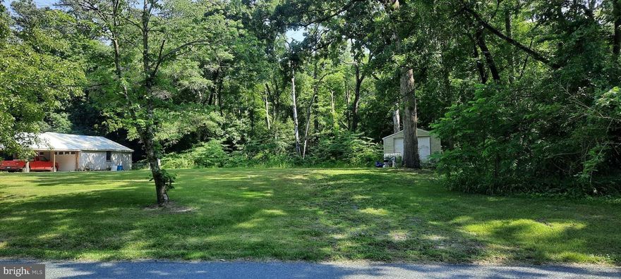 Very desirable lot in an up and coming town  is just a hop, skip and a jump to Cherry Beach.  Lot is high and sandy, semi private and there is a small creek that runs towards the back of the property . Very close to Cherry Beach Boat ramp. Easy commute to Salisbury, Delmar, Laurel, Seaford, Cambridge, and Route 50.
12x24 Outbuilding on lot.  Existing well & Septic, existing electric service .  Seller is selling as-is as they have never had utilities connected or checked well & septic.  Buyer and Buyer's agent should do their due diligence in verifying all information.