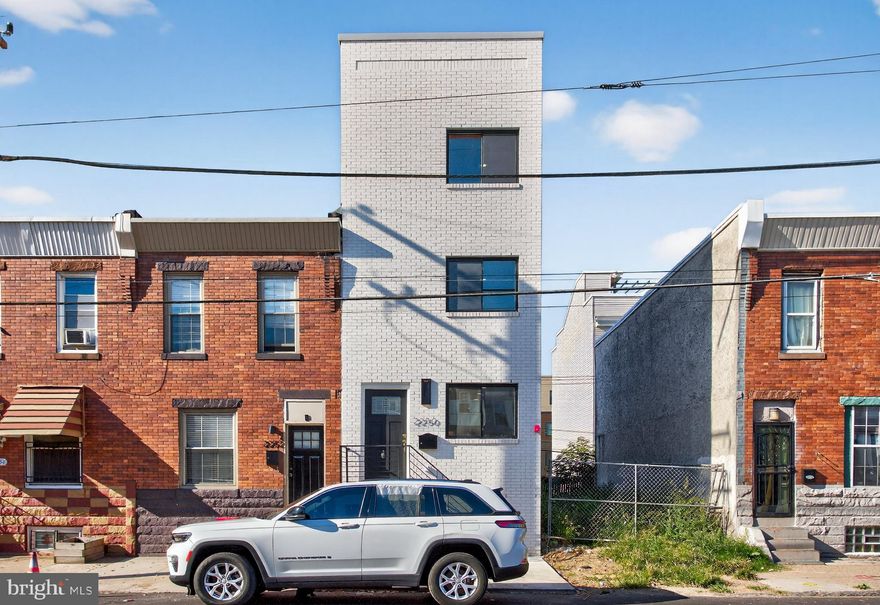 Step into sophistication and modern comfort with this exceptional new construction residence, a 3-story home with a fully finished basement that together create the experience and feel of a 4-story luxury property. Every inch of this home is a showcase of thoughtful design, high-end finishes, and true craftsmanship—delivering an elevated lifestyle in one of Philadelphia’s most exciting and fast-growing neighborhoods.

The third floor is a private retreat devoted entirely to the primary suite, featuring a spacious 13x13 master bedroom, a 15x5 custom walk-in closet, and an impressive 13x12 spa-inspired bathroom with double rainfall showers and his-and-hers vanities. This elegant space blends modern style with ultimate comfort for the perfect escape.

The second floor offers two bright and spacious bedrooms (each 13x11), both with generous closets (65x22) and a beautifully designed full bathroom enhanced by black accent fixtures and contemporary finishes. Oversized 48x60 windows fill every room with natural light, adding warmth and openness throughout.

On the main level, the open-concept kitchen and living area bring form and function together. The kitchen showcases tall modern cabinetry, a central island for additional counter space, and premium stainless steel appliances, all set within a sleek, modern layout perfect for entertaining or daily living.

The fully finished basement expands your living space even further, complete with a full bathroom, making it ideal for a guest suite, media room, or family gatherings. This level adds depth and versatility, creating the full impression of a 4-level home designed for today’s lifestyle.

Throughout the entire house, including the basement, you’ll find luxury vinyl plank flooring, offering style, durability, and a seamless flow. The architectural staircase, built with a central steel beam and thick reclaimed pine wood slabs (12x36x11), stands as a stunning design centerpiece—merging industrial strength with handcrafted artistry.

Built with both elegance and safety in mind, this home includes a modern fire sprinkler system and a fiberglass rooftop deck—a perfect space to relax, watch the stars, and enjoy breathtaking city skyline views.

Conveniently located near Aramingo Avenue, this home provides quick access to major routes, shopping, dining, and a vibrant community surrounded by other new construction developments.

Experience the perfect combination of modern luxury, functional design, and architectural beauty—a 3-story masterpiece with a full finished basement that truly feels like a 4-story dream home.