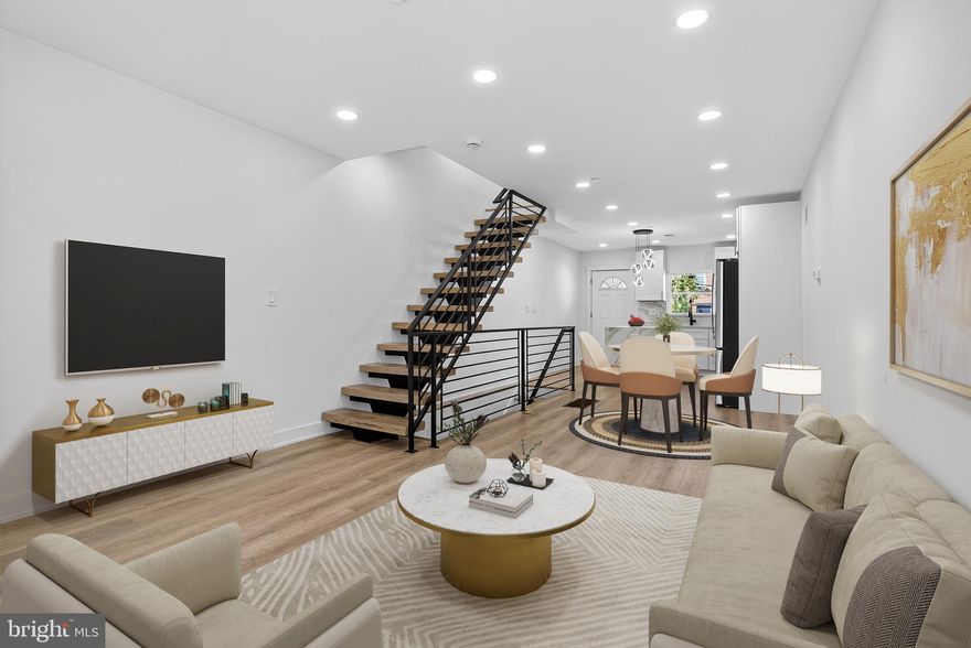 Step into sophistication and modern comfort with this exceptional new construction residence, a 3-story home with a fully finished basement that together create the experience and feel of a 4-story luxury property. Every inch of this home is a showcase of thoughtful design, high-end finishes, and true craftsmanship—delivering an elevated lifestyle in one of Philadelphia’s most exciting and fast-growing neighborhoods.

The third floor is a private retreat devoted entirely to the primary suite, featuring a spacious 13x13 master bedroom, a 15x5 custom walk-in closet, and an impressive 13x12 spa-inspired bathroom with double rainfall showers and his-and-hers vanities. This elegant space blends modern style with ultimate comfort for the perfect escape.

The second floor offers two bright and spacious bedrooms (each 13x11), both with generous closets (65x22) and a beautifully designed full bathroom enhanced by black accent fixtures and contemporary finishes. Oversized 48x60 windows fill every room with natural light, adding warmth and openness throughout.

On the main level, the open-concept kitchen and living area bring form and function together. The kitchen showcases tall modern cabinetry, a central island for additional counter space, and premium stainless steel appliances, all set within a sleek, modern layout perfect for entertaining or daily living.

The fully finished basement expands your living space even further, complete with a full bathroom, making it ideal for a guest suite, media room, or family gatherings. This level adds depth and versatility, creating the full impression of a 4-level home designed for today’s lifestyle.

Throughout the entire house, including the basement, you’ll find luxury vinyl plank flooring, offering style, durability, and a seamless flow. The architectural staircase, built with a central steel beam and thick reclaimed pine wood slabs (12x36x11), stands as a stunning design centerpiece—merging industrial strength with handcrafted artistry.

Built with both elegance and safety in mind, this home includes a modern fire sprinkler system and a fiberglass rooftop deck—a perfect space to relax, watch the stars, and enjoy breathtaking city skyline views.

Conveniently located near Aramingo Avenue, this home provides quick access to major routes, shopping, dining, and a vibrant community surrounded by other new construction developments.

Experience the perfect combination of modern luxury, functional design, and architectural beauty—a 3-story masterpiece with a full finished basement that truly feels like a 4-story dream home.