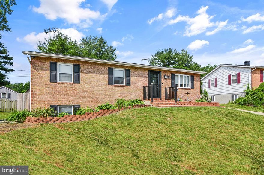 Prepare to be impressed by this awesome brick front rancher in Parkville!  Main level has spacious living room with bay window and hardwood floors and wide open floorplan with adjoining dining room.  Step down into a very spacious kitchen with updated cabinets, granite counters, stainless appliances and sliding door to rear yard.  Kitchen has ceramic tile flooring and backsplash plus under cabinet lighting, both at the counter level and also down at the toe kick to light up the floor.  Stay comfortable all year with a separate mini-split HVAC just for the kitchen area/rear of home.  At the end of the hallway, there is a spacious primary bedroom suite with recessed lights, ceiling fan, mirror door closet and fully updated bath. There are two additional bedrooms served by a full bath in the hallway, which has also been updated.  In the lower level, there is  a very large and updated family/rec room with enough space to divide into seating area/game area, etc.  There is a fourth bedroom or home office/bonus room, an updated half bathroom and a large laundry/storage room with newer washer/dryer.  Plus a door to the rear yard.  The sliding doors from the kitchen lead to a patio area with stairs to a very large wrap-around deck along the pool.  There is low voltage lighting around the pool and also in the front landscaping. The entire rear yard has a 6' privacy fence which was just replaced in 2021.  There is a practically new 12x24 garage with electric sub panel plus a separate storage shed.  The roof was just replaced with architectural shingles in 2021.   House backs up to Double Rock park and even has a gate in the rear fence to walk right into the park!  The park features 100+ acres of protected area and has playground, ball fields, pavilion, walking trails and more.  Offer Deadline: Thursday July 20th at 8pm.
