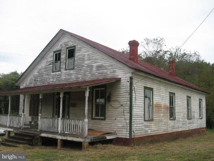 Renovate this home as you like, solid structure with metal roof, front and back porch, nice in-town location, nice yard, needs septic, town water, great potential!