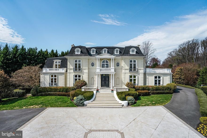 $500,000 Price Improvement – Extraordinary Value for an Iconic McLean Estate
French Château Elegance on 5 Private Acres with Resort-Style Grounds
Welcome to a masterpiece of timeless grandeur and refined luxury, nestled on five majestic acres in the heart of McLean. Inspired by the châteaux of the Loire Valley, this one-of-a-kind estate is a true architectural jewel offering unrivaled privacy, scale, and craftsmanship—now offered with an incredible $500,000 price improvement.

From the moment you approach the stately gated motor court, the residence makes a commanding impression. A classic mansard roof, Juliet balconies with wrought iron railings, and expansive rooftop terraces evoke a sense of regal sophistication. Double doors open into a breathtaking two-story foyer, crowned by 20-foot ceilings, travertine floors, and gilded crown moldings that set the tone for this exquisite home.

Grand Interiors Designed to Impress
Sweeping marble staircase with gold-leaf wrought iron and brass railings—an unforgettable centerpiece
Private executive office with floor-to-ceiling mahogany built-ins and a gas fireplace
Formal dining room with custom china cabinetry and elegant fireplace, ideal for lavish entertaining
Formal living room with triple-arched French doors, ornamental plasterwork, and a grand fireplace
Full-service bar in cherry, walnut, and leaded glass connecting to a magnificent great room with soaring ceilings

Gourmet Kitchen & Casual Living
Chef-inspired kitchen with dual oversized islands, granite countertops, and premium cabinetry
Breakfast room opening to a cozy family room with a stunning stone fireplace
Butler’s pantry, elegant powder room, and oversized laundry room provide practical luxury

Private Quarters of Distinction
Primary suite is a true sanctuary with private balconies, fireplace, dual walk-in closets with granite tops, and a spa-style bath featuring Jerusalem Gold limestone, jetted tub, and steam shower.

Four additional ensuite bedrooms with refined finishes, crown molding, and walk-in closets
Expansive rooftop terrace off the grand hall with panoramic views of the estate

Entertainment & Wellness Retreat
Walk-out lower level with full bar, rec room, game room, gym, and sixth bedroom suite
Bonus rooms include a cedar closet, staff/maids quarters, and abundant storage
Four-car garage with EV charger, climate control, and custom cabinetry
World-Class Outdoor Living
50’ x 25’ heated pool with retractable electronic cover
Glass stone firepit, cascading waterfall pond, and multiple stone terraces
Lush, mature landscaping with ambient lighting, tiered gardens, and intimate garden pathways
Private courtyard patio with lattice privacy panels and gated access to pool and service drive

Modern Comfort Meets Classic Opulence
Whole-house generator
Newer seven-zone HVAC system
Smart home upgrades and security throughout

Why This Estate Stands Apart
This is more than a home—it's a statement of success and legacy. A property of this caliber, combining European charm with modern amenities, rarely becomes available in McLean. With a $500,000 price improvement, this extraordinary offering is not only captivating—it’s an incredible value.

Private showings by appointment only. Experience the grandeur, the serenity, and the luxury lifestyle you deserve.