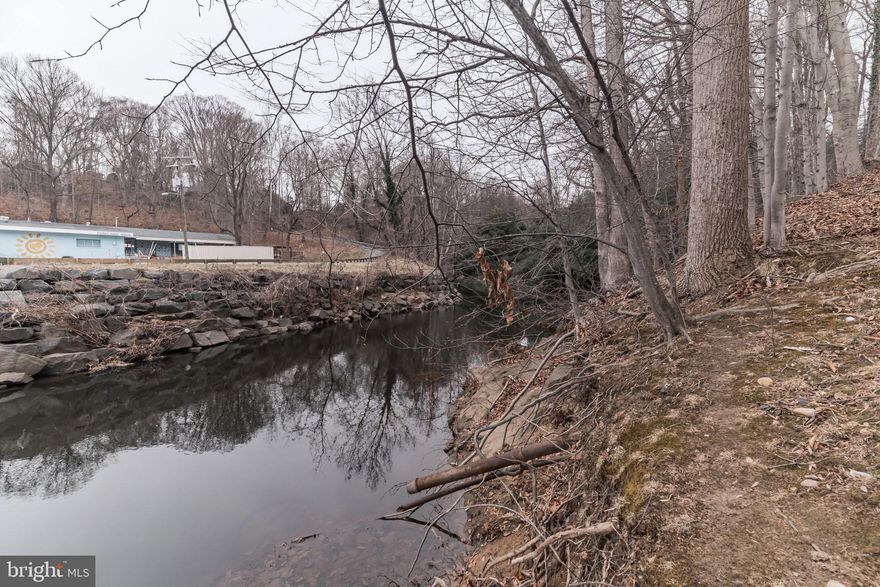 THIS EXTRAORDINARY PROPERTY IS A MUST SEE!!  ZONED R-3 (3 DU/AC) INSIDE THE BELTWAY WITH HOLMES RUN STREAM RUNNING THRU IT..