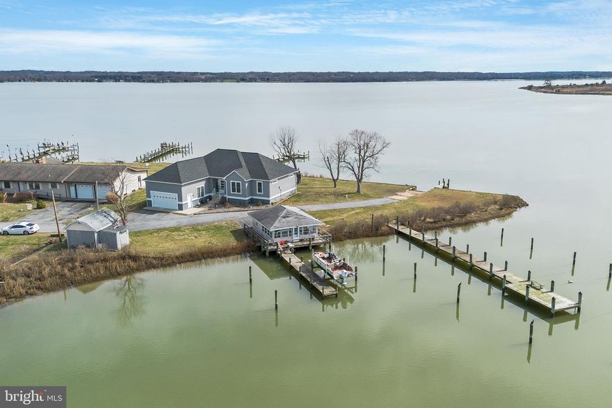 This exceptional waterfront home has the most stunning views of the Patuxent River and  the protected water ofTrent Hall Creek.  This four year young 3 bedroom, 2 full bathroom home has sophisticated style all throughout the interior.  Located on over a half acre, the property offers 4 piers and electric boat lift and a boat ramp.  The detached 20x26 crab shack has another full bath for use after playing in the sun all day or just to wash up after getting your hands dirty with crabs you caught on your own pier.  The gorgeous view from the back porch over looking the water will keep you mesmerized from coffee to cocktails.