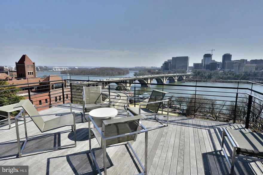 Stunning city residence with award-winning, unparalleled and commanding views of the Potomac River & Key Bridge! Substantial renovation throughout 4 levels of luxury living plus roof deck w/hot tub. Highlights a 2-story "view room" w/wet bar, living room w/FP, modern kitchen & baths, spacious owner's suite w/floor to ceiling windows & media area, whole house multimedia system & 1-car gar parking.