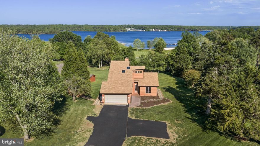 Stunning fully furnished water view home with deep water deeded boat slip (#78) in the highly desirable gated community of Windwood Coves. This property is located within the highly sought after Louisa school district  on the public side of Lake Anna!  Perfectly positioned mid-lake, this beautifully updated property offers the ultimate blend of comfort, convenience, and year-round lake living. Enjoy easy access to shopping, restaurants, breweries, and all the best Lake Anna has to offer—plus a short walk to the community beach. Community amenities include a deeded boat slip, boat ramp, tot lots, volleyball courts, picnic pavilions, and more.
This inviting 3-bedroom, 2-full-bath home features a warm and functional layout with a cozy fireplace, spacious loft with additional sleeping area/futon, and a large kitchen and breakfast area showcasing top-of-the-line KraftMaid cabinetry with glass-front and lighted details. The upper-level primary suite is a true retreat, offering peaceful mornings with gorgeous sunrise water views. Step outside to your updated 800+ sq ft deck, designed for effortless outdoor living—perfect for entertaining, relaxing, or taking in the serene lake setting. High speed internet fiber run throughout the neighborhood.
Whether you're searching for a full-time residence, weekend getaway, or turnkey investment opportunity (proven long term rental history), this home checks every box. Offered fully furnished, allowing you to start enjoying lake life immediately, or an instant source of rental revenue.

Updates include new roof (March 2026), Deck Replacement (April 2025), New flooring (Sept. 2024), New well pump (August 2023).  Owner - licensed agent.