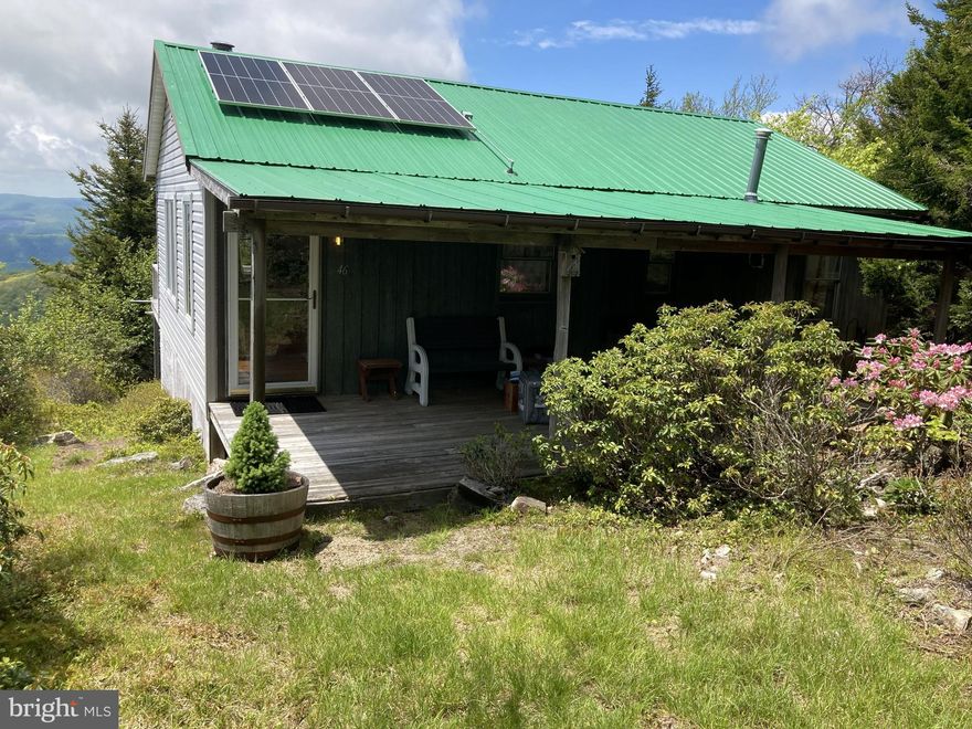 This lovingly maintained, cozy cabin on 5-acre lot in Kile Knob, offers a unique opportunity to have your off grid, dream retreat in a picturesque mountain setting. The property is characterized by its mountainous terrain, providing a sense of privacy and seclusion that is hard to find. Lush woodlands surround the area, enhancing the natural beauty and tranquility of the landscape. Imagine waking up to breathtaking views of majestic mountains and the soothing sounds of nature. The architectural style of the the cabin complements the natural surroundings, inviting you to immerse yourself in the rustic charm of mountain living. With plenty of room to roam throughout the development and access to an additional common area, this property is perfect for those seeking a peaceful escape or an adventurous lifestyle. The presence of a run-in shed adds functionality, making it ideal for hobbyists or those looking to store equipment. Conveniently located yet secluded, this lot offers the best of both worlds. Enjoy the tranquility of a peaceful sanctuary while being just a short drive from local amenities. This is more than just a piece of land; it's an invitation to embrace a lifestyle defined by nature, comfort, and endless possibilities. Don't miss the chance to make this extraordinary property your own. This cabin uses solar power and propane. The association fee includes road maintenance, however it is not always accessible throughout the winter months since there is no snow removal. Some covenants and restrictions apply.