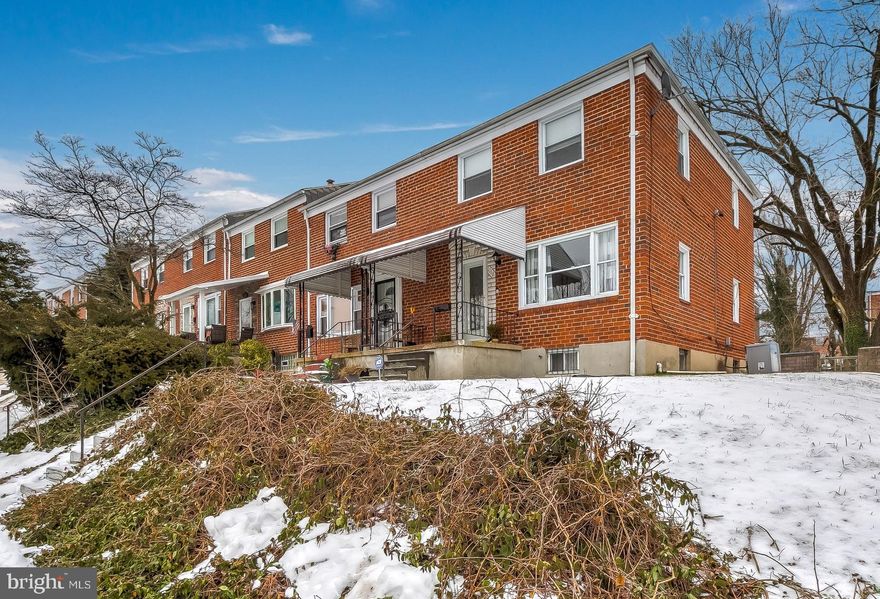 ** HIGHEST & BEST OFFERS ARE DUE BY 5PM ON MONDAY, 2/22**  Impeccably maintained and updated large end unit home with spacious rear and side yard- a perfect place to enjoy the warmer days ahead and there is a large, mature tree out back that provides shade and natural beauty. The front porch welcomes you into the main level of this home with wood floors and an open floor plan with a large, light & bright living room that leads to the separate dining room and the beautifully updated, well designed and open kitchen with granite countertops, tile backsplash, stainless steel appliances, and a large island. Upstairs are three bedrooms and an updated full bathroom with built-in shelving in the large hallway- a smart use of the space. The lower level has a convenient half bathroom, laundry room, ample storage space, and a large finished room/flex space that is perfect for a variety of needs such as an extra bedroom, family room, den, at home office or education space, studio, hobby room, etc., the possibilities are endless! This lovely home sits on a quiet, tree-lined  street in a fantastic location that is convenient to shopping, restaurants, parks, and an easy commute to both Baltimore City and County.