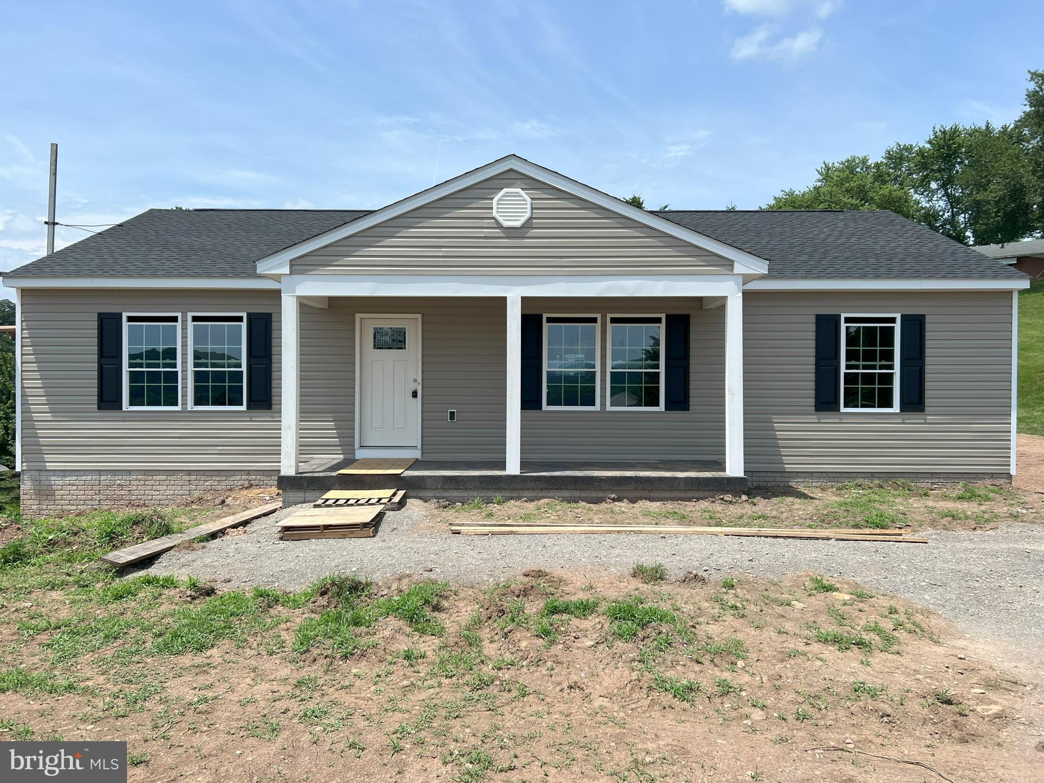 Welcome home to this charming new construction rancher nestled in the heart of Hancock, MD. Boasting 1,500 square feet of modern living space on the main level with approximately 700 finished square feet in the basement, this home offers 3 bedrooms and 2 full bathrooms, and laundry on the main floor, providing ample room for comfortable living. Step inside to discover an inviting open concept layout, seamlessly connecting the kitchen, dining area, and living room. Perfect for entertaining guests or enjoying quality time with family, this spacious design allows for effortless flow throughout the main living areas. LVP floors and abundant natural light create a warm and inviting atmosphere, while the kitchen features sleek countertops, stainless steel appliances, and ample cabinet storage, making meal preparation a breeze.
Step downstairs to the basement and you have an additional bedroom, full bathroom, plus a large finished rec room. Relax and unwind on the covered front porch while taking in the amazing view looking out over the town of Hancock toward the East/Southeast. This home offers the convenience of off-street parking with your very own stamped concrete driveway prepped for your EV charging port.
Plus, with easy access to all that Hancock has to offer, including charming Main Street shops, the scenic Western Maryland Rail Trail, the historic C&O Canal, and the majestic Potomac River, endless outdoor adventures await just beyond your doorstep. Don't miss your opportunity to make this delightful Hancock retreat your own. Schedule your showing today and experience the perfect blend of comfort, convenience, and small-town charm!