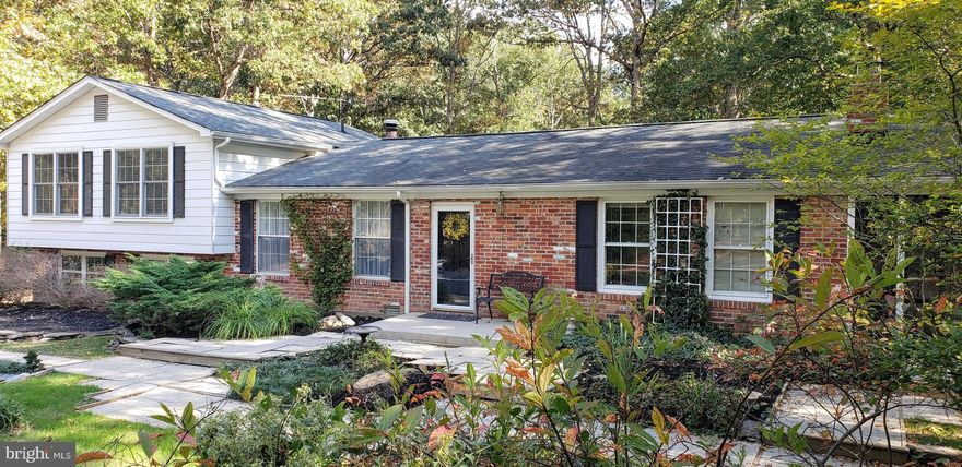 Park-like setting on almost 3.5 acres. Privacy at it's best!  Sun filled custom kitchen with skylights and island cook top open to formal dining room and connects to huge family room with brick fireplace.  Screened in patio opens to scenic yard views and stream at back of lot.  Lots of space for gardening or just enjoying the outdoors. Unfinished basement area is great for workshop or finish for extra space.  Currently zoned for new Billingsley elementary school.  The best of country living, but close to shopping and convenient for commuters!  Qualifies for USDA 100% financing.