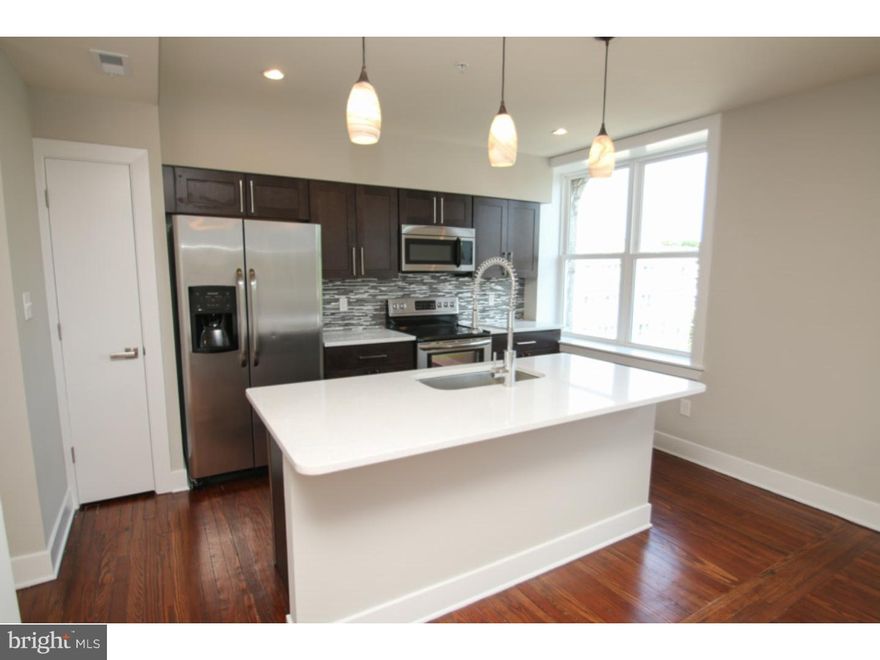 A stunning unit in the Sedgley for rent! All the units in this rehabbed corner property include a wide variety of fantastic finishes and features, including central air, reclaimed pine hardwood flooring, recessed lighting, ceiling fans, high ceilings and large windows for tons of natural light. Enter and discover the large unit with an open and inviting living and dining area, showcasing the kitchen which includes quartz counters, subway tile backsplash and electric stainless steel appliances. The unit also features two light filled bedrooms which include tons of closet space, as well as two tiled bathrooms with quartz counter vanities. Washer and dryer are included in the unit, and bike storage is available in the basement for your comfort and convenience. This pet friendly building is close to universities, hospitals,shopping and public transportation, leaving you just minutes away from Center City.