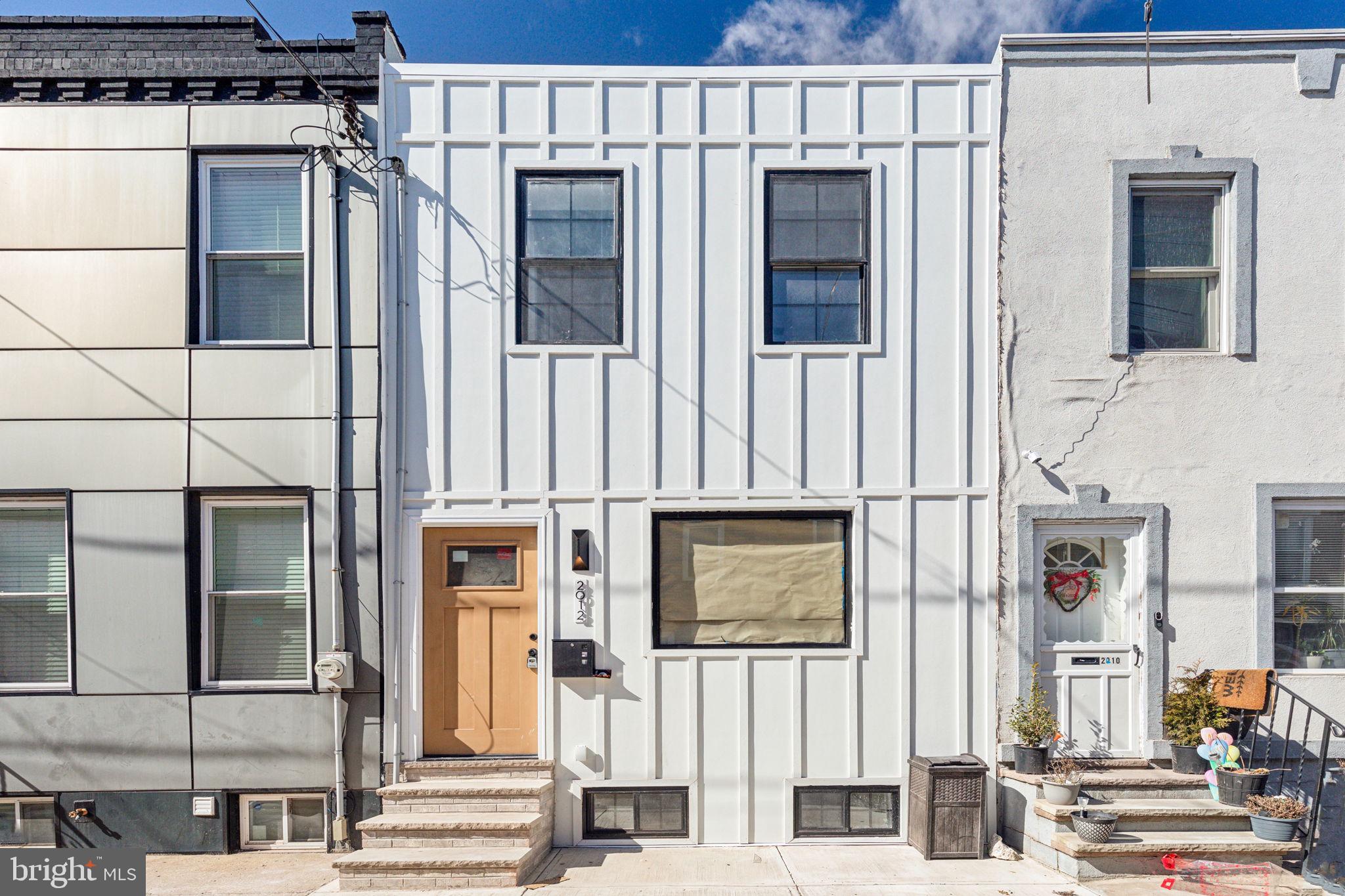 Welcome to 2012 S Mildred Street – a thoughtfully designed, fully updated 3-bedroom, 1.5-bath gem offering approximately 1,200 sq ft of modern living in one of South Philly’s most desirable neighborhoods.
Step inside to discover an open-concept layout flooded with natural light and elevated by contemporary finishes. The spacious living and dining areas feature sleek hardwood floors and customizable LED lighting throughout, including stair lights that activate as you approach – a touch of innovation and luxury that sets this home apart.
The show-stopping kitchen is a chef’s dream, boasting soft-close cabinetry, under-cabinet and counter-integrated LED lighting, quartz countertops, and a smart stove/range that combines modern aesthetics with cutting-edge technology.
Upstairs, three comfortable bedrooms offer ample space and style, while the updated full bath and main-level powder room feature clean, modern finishes.
This house features an unfinished basement that has been properly waterproofed and has all new systems along with a brand new washer and dryer.
The exterior of the home is equally impressive with a custom-designed facade, hand-selected by a professional designer to make a bold, stylish statement.
From top to bottom, this home combines smart tech, custom lighting, and contemporary design to deliver a one-of-a-kind city living experience. Don’t miss your opportunity to own this turn-key, design-forward residence just minutes from East Passyunk, parks, and all that South Philly has to offer.