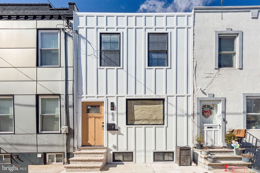 Welcome to 2012 S Mildred Street – a thoughtfully designed, fully updated 3-bedroom, 1.5-bath gem offering approximately 1,200 sq ft of modern living in one of South Philly’s most desirable neighborhoods.

Step inside to discover an open-concept layout flooded with natural light and elevated by contemporary finishes. The spacious living and dining areas feature sleek hardwood floors and customizable LED lighting throughout, including stair lights that activate as you approach – a touch of innovation and luxury that sets this home apart.

The show-stopping kitchen is a chef’s dream, boasting soft-close cabinetry, under-cabinet and counter-integrated LED lighting, quartz countertops, and a smart stove/range that combines modern aesthetics with cutting-edge technology.

Upstairs, three comfortable bedrooms offer ample space and style, while the updated full bath and main-level powder room feature clean, modern finishes.

This house features an unfinished basement that has been properly waterproofed and has all new systems along with a brand new washer and dryer.

The exterior of the home is equally impressive with a custom-designed facade, hand-selected by a professional designer to make a bold, stylish statement.

From top to bottom, this home combines smart tech, custom lighting, and contemporary design to deliver a one-of-a-kind city living experience. Don’t miss your opportunity to own this turn-key, design-forward residence just minutes from East Passyunk, parks, and all that South Philly has to offer.