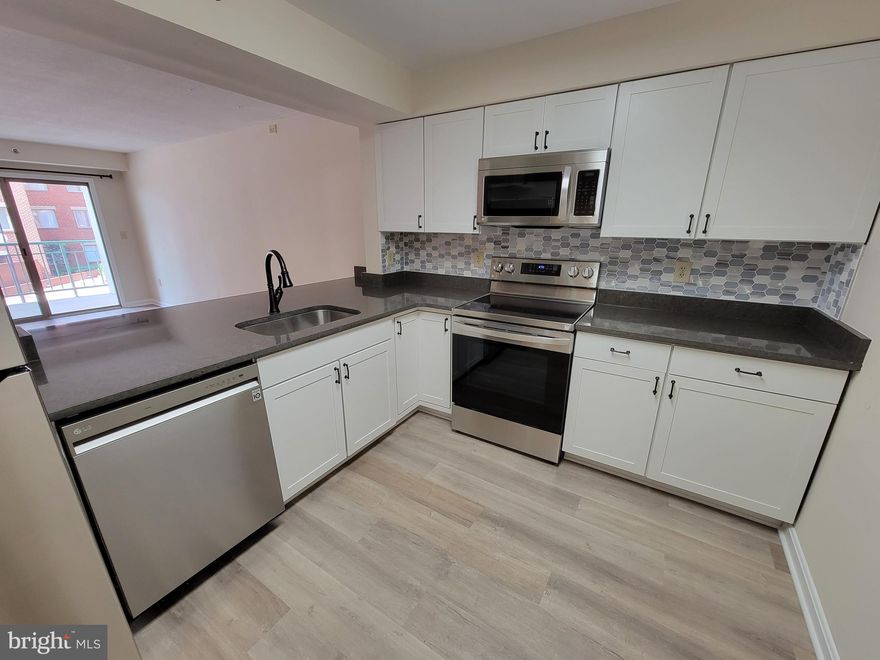 Renovated top to bottom... practically new everything!  Fabulous 2 bedroom/2 bath condo just steps the Braddock Road Metro.   Brand new open-concept kitchen with quartz countertops & stainless steel LG appliances.  Beautiful new bathrooms.  Luxury vinyl plank flooring in the kitchen and living room plus new carpet in the bedrooms.  New window treatments.   One assigned garage parking.  Fitness center in building.  W/D in unit.  Spacious balcony.  Pets considered on case-by-case basis.  Superb location.  Old town & Del Ray at your fingertips.  Moves allowed Monday - Friday between 9-5pm ($100 move-in fee) or the first and last Saturday per month between 9 to 1 ($200 move-in fee).  $200 move damage deposit for each move.