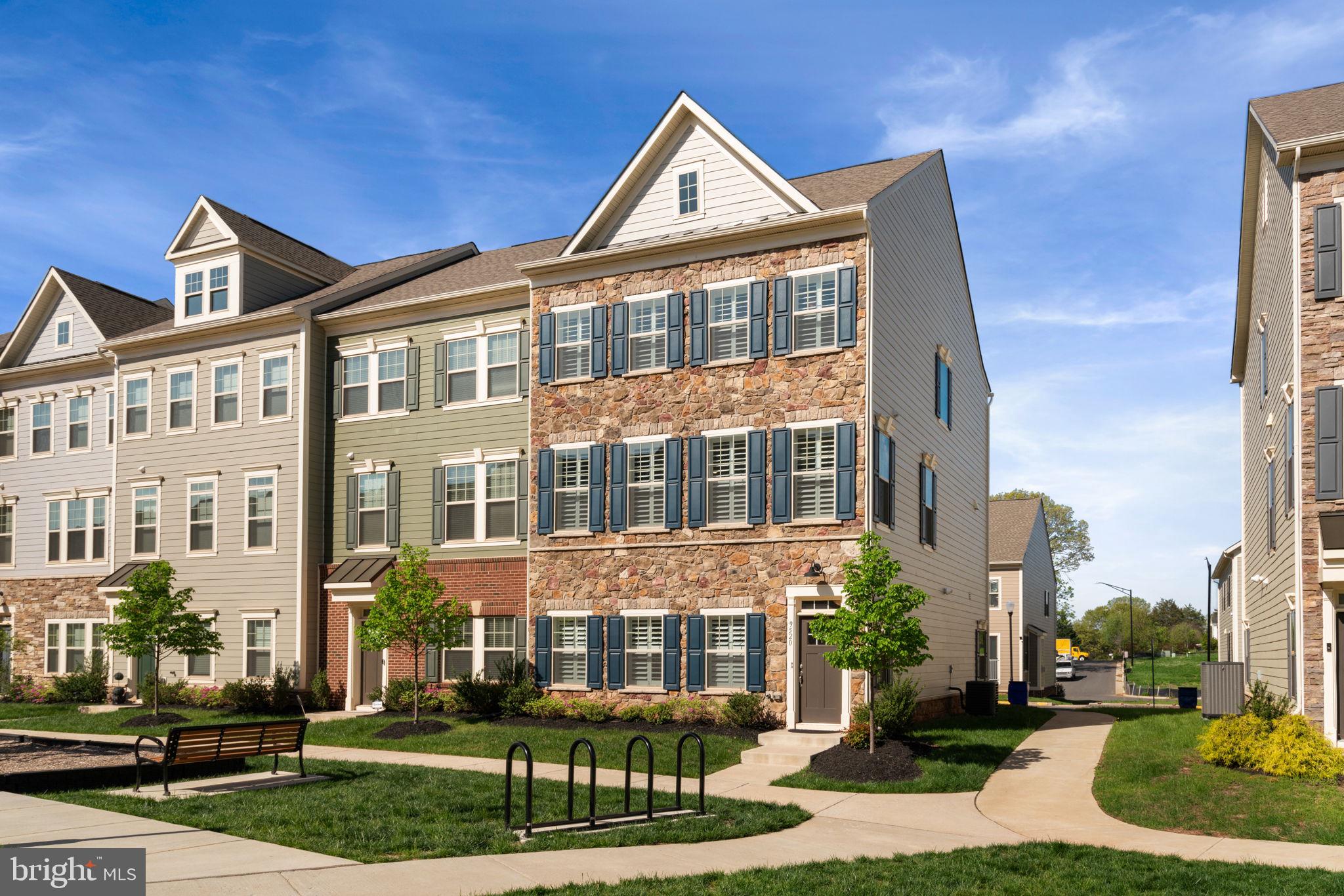 Enjoy nearby Historic Manassas in a nearly new townhome. Built in 2022, this 24' wide home is the largest townhouse model in Jefferson Square - only a few in the community! The spacious end-unit has an open main level with a gourmet kitchen that flows into the living room. The oversized island with barstools - ideal for entertaining. High-end finishes like Quartz countertops, top-of-the line wood shutters, and luxury vinyl plank flooring, oak stairs, Hardy Plank siding and Buckeye Fieldstone stone front. Three generous bedrooms and convenient laundry on the upper level. First floor has a 3rd full bath + rec room. Large 2 car garage + storage space, and a driveway that fits 2 cars side by side. Jefferson Square is built around a common area with playgrounds, community gardens, and a fire pit. This home is situated perfectly so you can step out the front door to enjoy all the amenities. Or take an easy 0.80 mile stroll to Manassas VRE, Saturday Farmers Market or lively, historic City of Manassas. Landscaping is included in the low $116 monthly HOA fee!