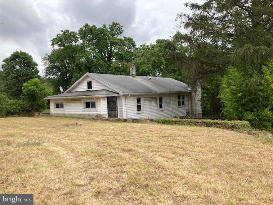 Investor's Dream......Welcome to 217 Philadelphia Road.   Two bedroom, 1 bath can be reconfigured to 3/2.  Tear down and build new,  your choice.  Over 2 acres of land.  This one won't last long.  Seller would prefer using Clear Title.