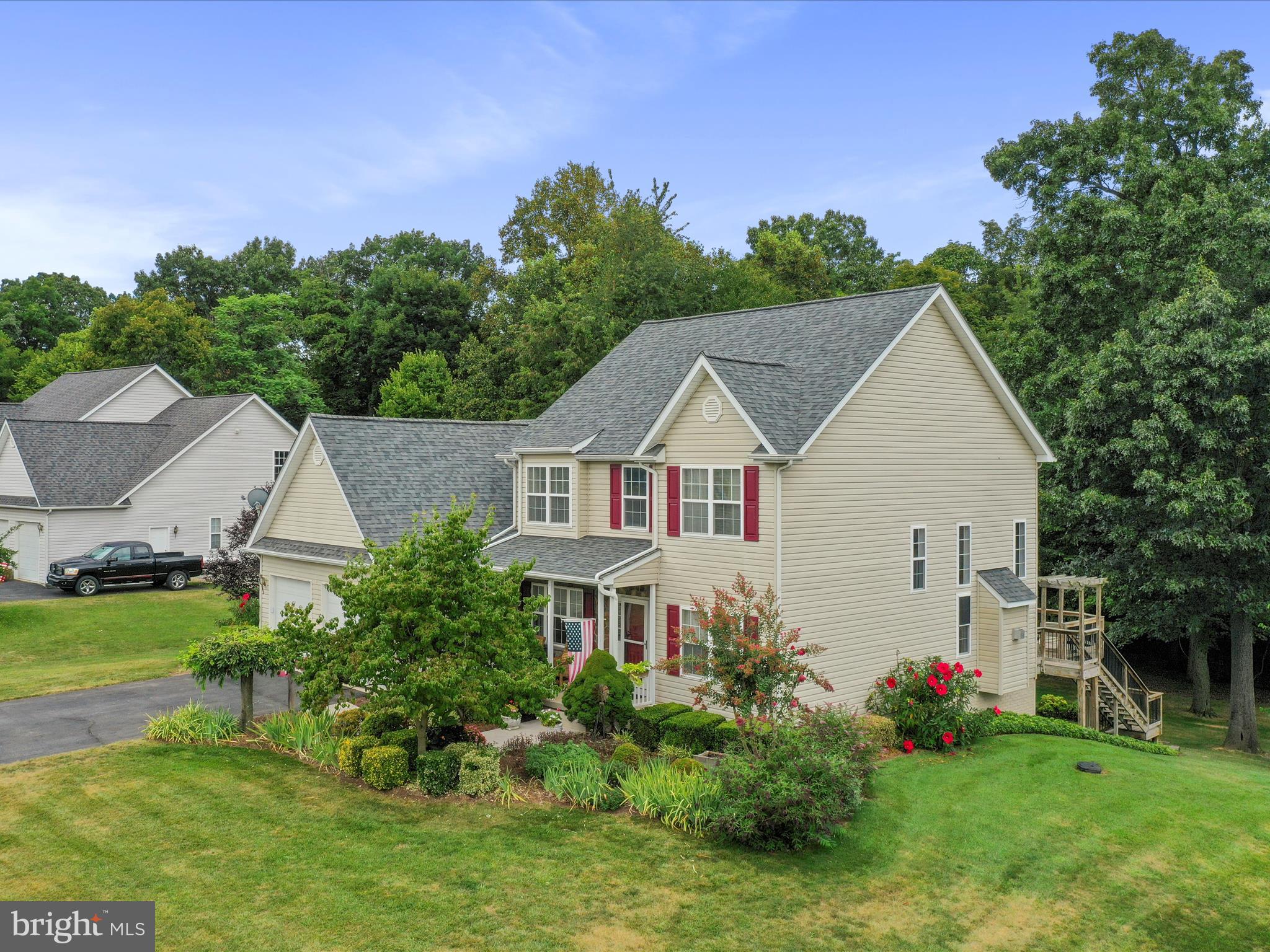 Beautiful, one owner home in the heavily sought after neighborhood, Apple Knolls Estates. Situated on a cul-de-sac, containing 1.10 acres consisting of a partly wooded, yet parklike setting. Inside this meticulously maintained home, you will find a primary bedroom and bathroom on the main level and 3 nicely sized bedrooms and full bathroom upstairs. Also on the main level is the laundry room, formal living and dining room, spacious TV room with gorgeous stone gas fireplace that extends to the ceiling, luxury vinyl plank flooring, and large windows allowing natural sunlight to flow inside. The kitchen and breakfast room contain heated ceramic tile flooring for those chilly mornings, and the breakfast room also has several large windows that the plants will love. The large deck is equipped with a sun setter awning and steps that lead to the spacious backyard. The partially unfinished walkout basement is ready to finish if desired as a full bathroom is already installed. There is plenty of storage with built in shelving, utility sink, and tankless propane water heater. The oversized 2 car garage is an added plus and there is separate garage to store the lawn equipment just outside the walk out basement. The roof with gutter guards was installed in 2023. Tru Green lawn service has been paid through 2025. The property extends beyond the cluster of trees in the back yard where it is cleared. This home has been well loved and cared for and it is very evident.