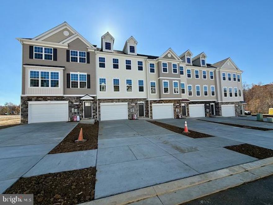 ***October Delivery****

Welcome to the Madison D2, a spacious and thoughtfully designed townhome by Quality Built Homes located in the vibrant new community of Meadows at Town Run II in Leonardtown, MD. This 3-level, 2,604 sq ft interior unit offers flexible living space, starting with a main-level entry that opens into a finished rec room or 4th bedroom with a full bath, perfect for a guest suite or home office. 

Upstairs, enjoy 9’ ceilings, luxury vinyl plank flooring, and an open-concept kitchen featuring 42" upgraded maple cabinets, upgraded granite countertops, a large center island, walk-in pantry, and stainless steel GE appliances. The kitchen flows seamlessly into the dining area and oversized family room, with access to a 14x12 maintenance-free deck overlooking your private, fenced-in backyard.

The upper level boasts a spacious owner’s suite with tray ceiling, walk-in closet, and a luxurious ensuite bath with dual vanities and QBHI’s signature deluxe tiled shower. Two additional bedrooms, a full hall bath, and a convenient laundry room complete the top floor. 

Additional features include: Oversized 1-car garage and 2-car wide driveway, finished and painted garage with drywall, smart home technology with IQ Pro command center, Skybell camera doorbell, and smart thermostat

Low-maintenance exterior with stone-to-grade front (per elevation), sodded yard, vinyl fencing, and landscaping package. Community amenities include sidewalks, recreation center, pool, playground, pickleball, and tennis courts, all in the heart of charming Leonardtown.  Photos shown are representative and intended to illustrate a similar finished townhouse.