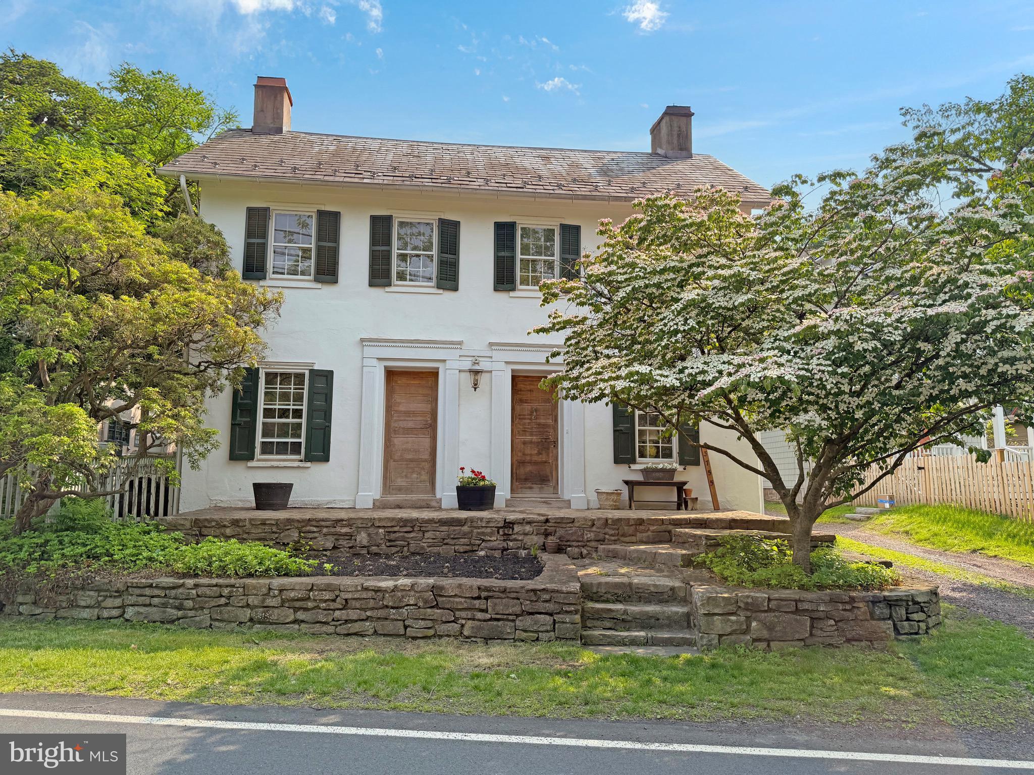 Step into timeless elegance with this 4-bedroom, 2.5-bath stucco-over-stone home, dating back to 1839. Rich in history and character, this residence beautifully blends original architectural details with modern-day comfort. From deep-set window sills and intricate original moldings to vintage door hardware and a charming pie staircase, every corner of this home tells a story.
Enjoy sweeping views of the Delaware River from many rooms, especially from the expansive living room, which features dual fireplaces and gleaming hardwood floors that flow throughout the home.
The outdoor spaces are just as captivating—an enchanting tiered backyard with flagstone patios, terraces, and a tranquil water feature complete with koi pond. An in-ground pool adds the perfect touch for warm-weather enjoyment and entertaining. Nestled in the historic river town of Lumberville, this home is just a short stroll from fine dining at the Black Bass Hotel, the scenic walking bridge to NJ state park, and access to the Delaware River Canal towpath, offering miles of trail for biking, walking, and enjoying the outdoors. Located in the sought-after Solebury Township, just minutes from downtown New Hope this property is a rare opportunity to own a piece of Bucks County history with all the beauty and serenity of riverfront living.