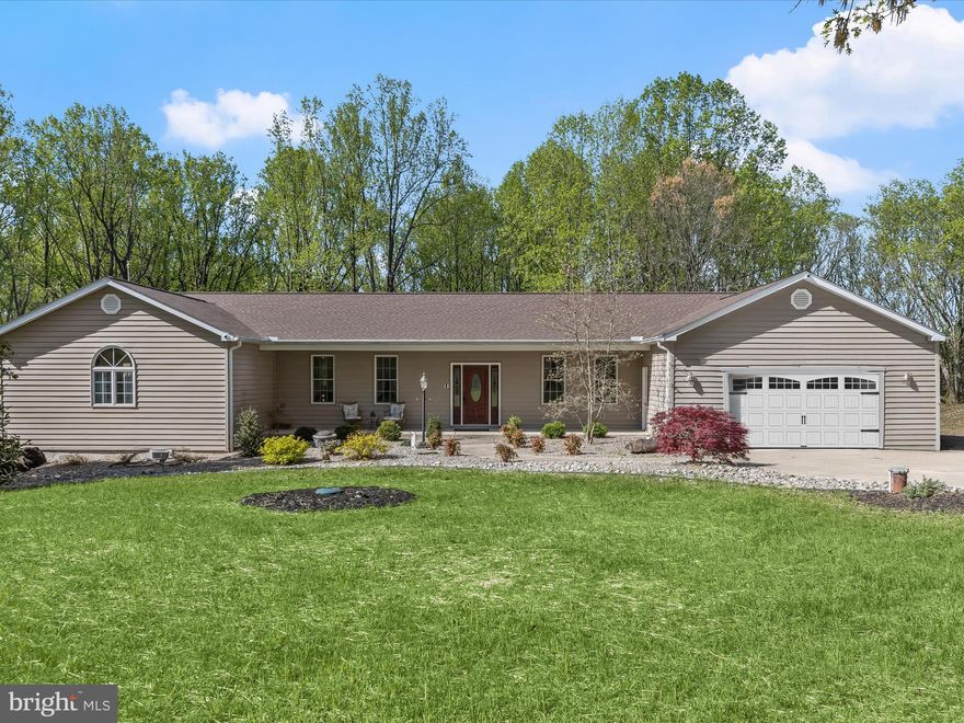 Discover this exquisite 4-bedroom, 3.5-bath residence where timeless elegance and modern comfort blend in perfect harmony, nestled against the serene backdrop of nature. A thoughtfully landscaped lawn leads you to a welcoming covered front porch and into a spacious foyer adorned with a soothing neutral palette and rich, Brazilian cherry hardwood floors that extend throughout the main living areas. Entertain with ease in the formal dining room, ideal for hosting everything from intimate dinners to festive celebrations. The dining space transitions seamlessly into a beautifully appointed eat-in kitchen featuring updated appliances—including a new refrigerator and dishwasher (2023)—42” solid maple Craftmaid cabinetry, a large center island with pendant lighting, and a convenient planning station. Bathed in natural light, the sunroom offers an inviting retreat with access to a Trex deck (2021), providing stunning views of the wooded property and a peaceful extension of your living space. Adjacent, the cozy living room offers the perfect spot to unwind in comfort. The primary bedroom suite is a luxurious sanctuary with a dual-entry walk-in closet and a spa-like en suite bath complete with a double sink vanity, walk-in shower, water closet with bidet, and a Palladian window that fills the space with warmth and light. Nearby, the home office, a second expansive bedroom with its own dual-entry en suite bath and walk-in closet, a third bedroom, a finished laundry room, and a convenient mudroom with garage access round out the thoughtfully designed main level. The fully finished lower level expands the home's versatility with a spacious recreation room featuring brand-new carpet and walkout access to the backyard. A large workshop with double-door exterior entry offers perfect storage for your lawn tractor and tools. You'll also find an impressive accessory dwelling space complete with a private entrance, full bath, walk-in closet, and a flexible open-concept layout that easily accommodates both a bedroom and living area. With a wet bar already in place and plenty of room for dining and a kitchenette, this area is ideal for extended family or guests. Recent upgrades include an architectural shingle roof (2023), a high-efficiency HVAC system (2022), well pump (2024), solid core interior doors, 9’ ceilings, Aquaglass showers, a rough-in for a soaking tub in the primary suite, Reolink camera security system, RV 30-amp and 50-amp hookups, and a whole-house water treatment system. Set in a tranquil, wooded setting just steps from one of Maryland’s most beloved parks, this remarkable property offers the perfect balance of privacy, luxury, and convenience—an exceptional place to call home.
***The sellers have received an offer and have set a deadline of Sunday 4/27 at 6pm.