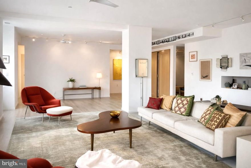 Here’s your opportunity to own a loft-style condo that has been beautifully reimagined by the owner. This expansive residence features 2 bedrooms, a den, an office, and 2.5 baths, offering unparalleled views of the Benjamin Franklin Parkway — all within one of the city’s most iconic historic buildings.

Upon entering, you’ll be greeted by crisp, airy contemporary finishes, including refinished Blanc hardwood floors that flow throughout the open layout. The chef’s kitchen boasts sleek slate countertops and modern appliances, perfect for both everyday living and entertaining.
Just off the entryway is a private office, ideal for working from home. The primary suite features sweeping Parkway views, a luxurious custom bath with custom steam shower and soaking tub, and a custom walk-in closet. The second bedroom also offers beautiful views, abundant natural light, and its own en-suite bath with a walk-in shower.
A versatile den provides the perfect space for a media or TV room, and there’s a convenient half bath off the hallway. Storage will never be an issue, with an additional room available for flexible use.
This truly one-of-a-kind home blends historic charm with modern design and will not last long!