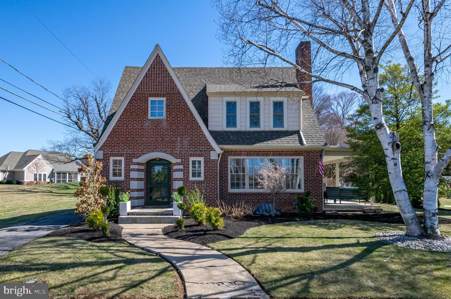 Multiple OFFERS have been received.  Highest and Best Sunday 3/30 at 8PM

Enjoy Tons of Charm and Character in this stunning Brick 2 story.  The First floor features beautiful hardwood floors and the large sundrenched living room includes a brick fireplace and pretty accent windows.  The adjoining Dining Room is spacious and has French doors leading to a large covered side porch, perfect for morning coffee or evening gatherings.  The New Custom Kitchen is spectacular, with an  oversized granite island that includes tons of banquette seating.  There is Gorgeous Tile flooring, and backsplash, and new stainless appliances including a beverage refrigerator.  An original Tile half bath is located just inside the entry.  Upstairs are three nice size bedrooms.  There is a walk-in closet in the hall and the Bathroom upgrades are spectacular with Custom double white vanity with stone top, woodworking, lighting and tile work.  The ceiling is vaulted with a Skylight too!  The lower level is clean and arranged into a family room, laundry area and workout space.  The landscaping is beautiful and the 2 car garage is close by and an outdoor seating area is ready for evening fires in the firepit.   This combination of Character and Modern upgrades is hard to find!