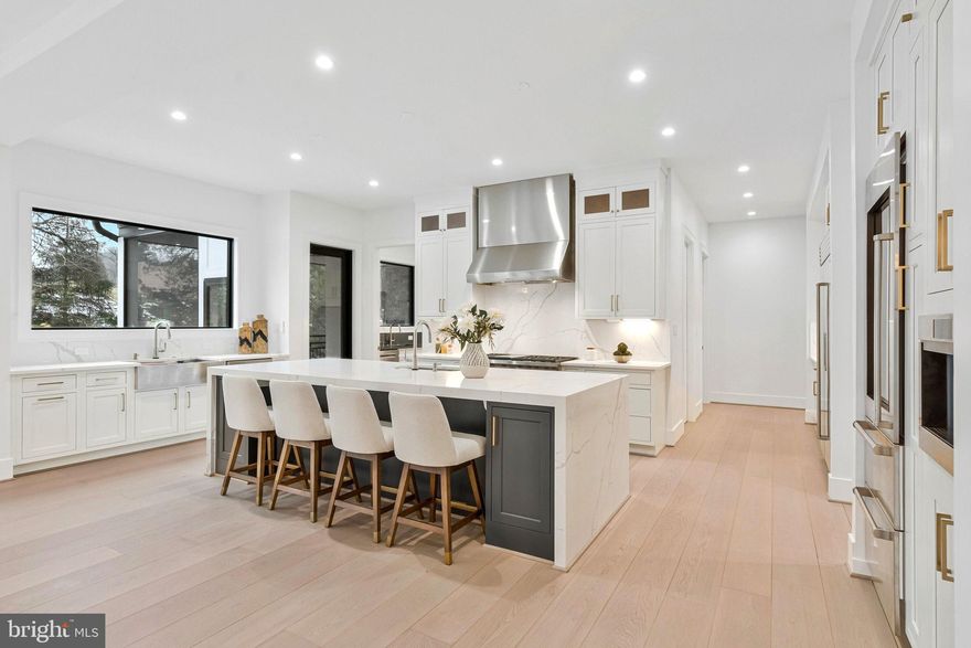 An extraordinary custom estate By KUL HOMES offering architectural distinction, refined craftsmanship, and uncompromising luxury. Thoughtfully designed with grand scale and exceptional flow, this residence is set on a private almost half acre lot backing onto lush greenery, creating a serene and exclusive retreat.
A striking open foyer makes a dramatic first impression, immediately showcasing the home’s sophisticated design and exquisite finishes. An integrated elevator shaft ensures seamless future accessibility. The expansive formal dining room is designed for unforgettable gatherings, while a private office offers an elegant and quiet workspace.
At the heart of the home lies a chef’s dream kitchen, curated with premium finishes and designed for both beauty and performance. The fully equipped spice kitchen allows for effortless entertaining and elevated culinary experiences. A main-floor bedroom paired with a full bathroom provides an ideal guest suite or multigenerational living option, offering privacy and comfort without compromise.
Every detail on this level has been meticulously considered to balance grandeur with warmth, creating spaces that feel both impressive and inviting.
The upper level is a showcase of refined comfort, featuring five generously sized bedrooms, each complete with its own luxurious ensuite bathroom. A beautifully designed loft serves as a cozy family lounge—perfect for relaxed evenings or intimate gatherings.
The owner’s suite is a statement of luxury and tranquility, offering expansive proportions and a lavish spa-inspired bathroom designed as a personal retreat. This serene space invites relaxation with a timeless, hotel-caliber ambiance.
The fully finished basement transforms the home into a complete lifestyle destination. Designed for entertainment and recreation, it features an expansive recreation room, a dedicated media room for cinematic experiences, and a private gym space for daily wellness. This level is ideal for hosting, unwinding, or creating unforgettable moments with family and friends.
Ideally situated near Tysons Corner, the home offers effortless access to major commuter routes, making daily travel seamless. Adding to its exceptional appeal, all three schools—elementary, middle, and high—are within walking distance, a rare and highly desirable convenience. This prime location delivers the perfect balance of privacy, accessibility, and everyday luxury. Some exterior photos have been edited to remove snow.