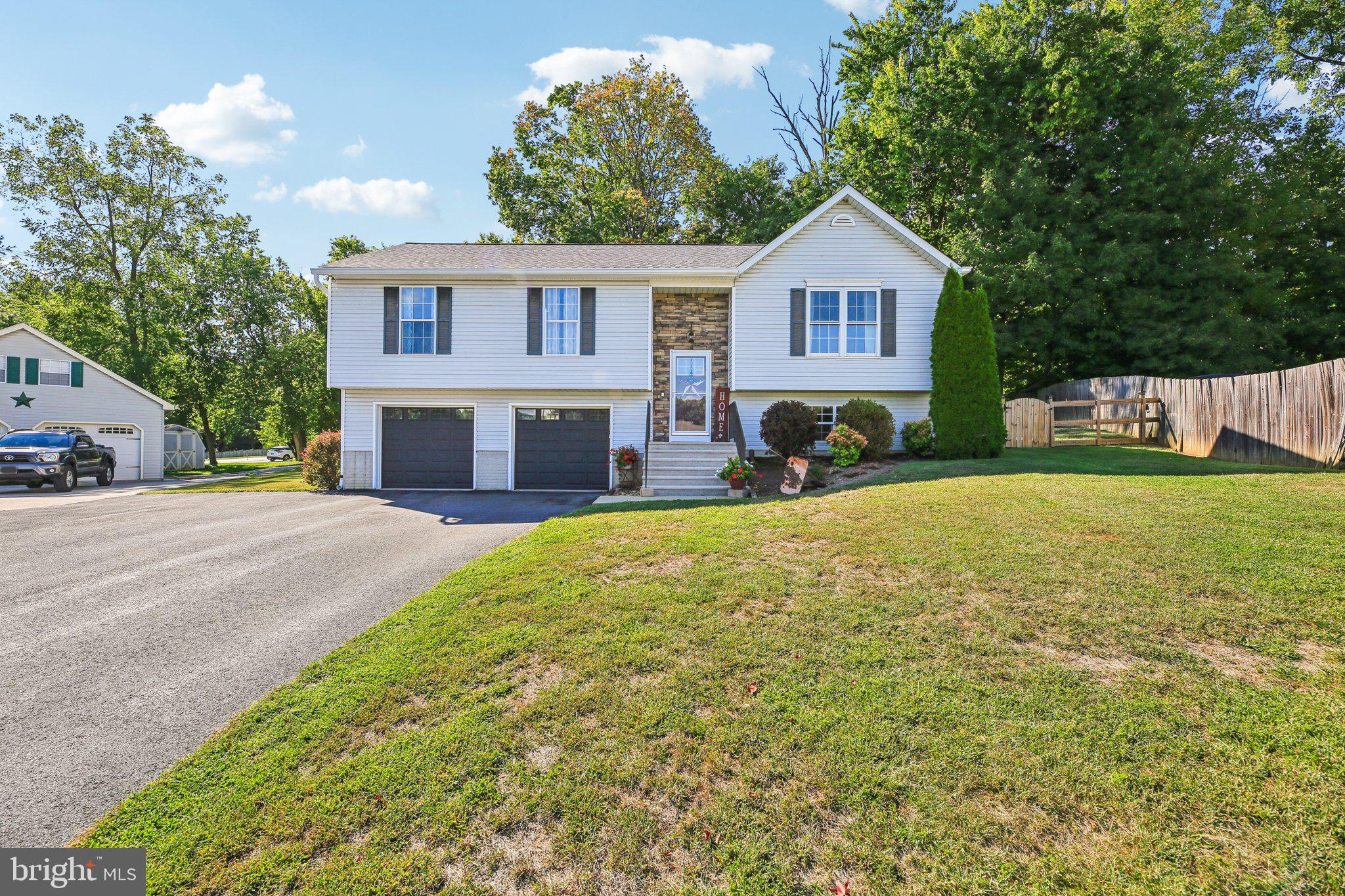 Discover the perfect blend of comfort, updates, and location in this beautifully maintained 3-bedroom, 2-bath split-foyer with a 2-car garage situated directly across from Libertytown Park. From the moment you step inside, you’ll notice the thoughtful improvements throughout, including brand-new flooring, updated light fixtures, and fresh finishes that create a warm and welcoming feel. The spacious kitchen serves as the heart of the home, featuring abundant cabinet storage, a large center island, and open sightlines to both the dining room and living area—ideal for entertaining or everyday living. The primary suite offers a relaxing retreat with its own private bath and generous closet space, while two additional bedrooms provide flexibility for family, guests, or a home office. Both bathrooms are designed for convenience, with modern touches that complement the home’s updated style. Peace of mind comes easy here with a new roof and gutters, as well as a newer water heater. Outdoors, enjoy a fully fenced backyard with a deck, patio, and fire pit area—perfect for summer barbecues, cozy fall evenings, or simply relaxing under the trees. A storage shed adds extra functionality. Beyond your backyard, Libertytown Park is just across the street, offering playgrounds, sports courts, and plenty of open green space for recreation. With its thoughtful updates, inviting spaces, and prime location, this home is ready for its next owner to move right in and enjoy.