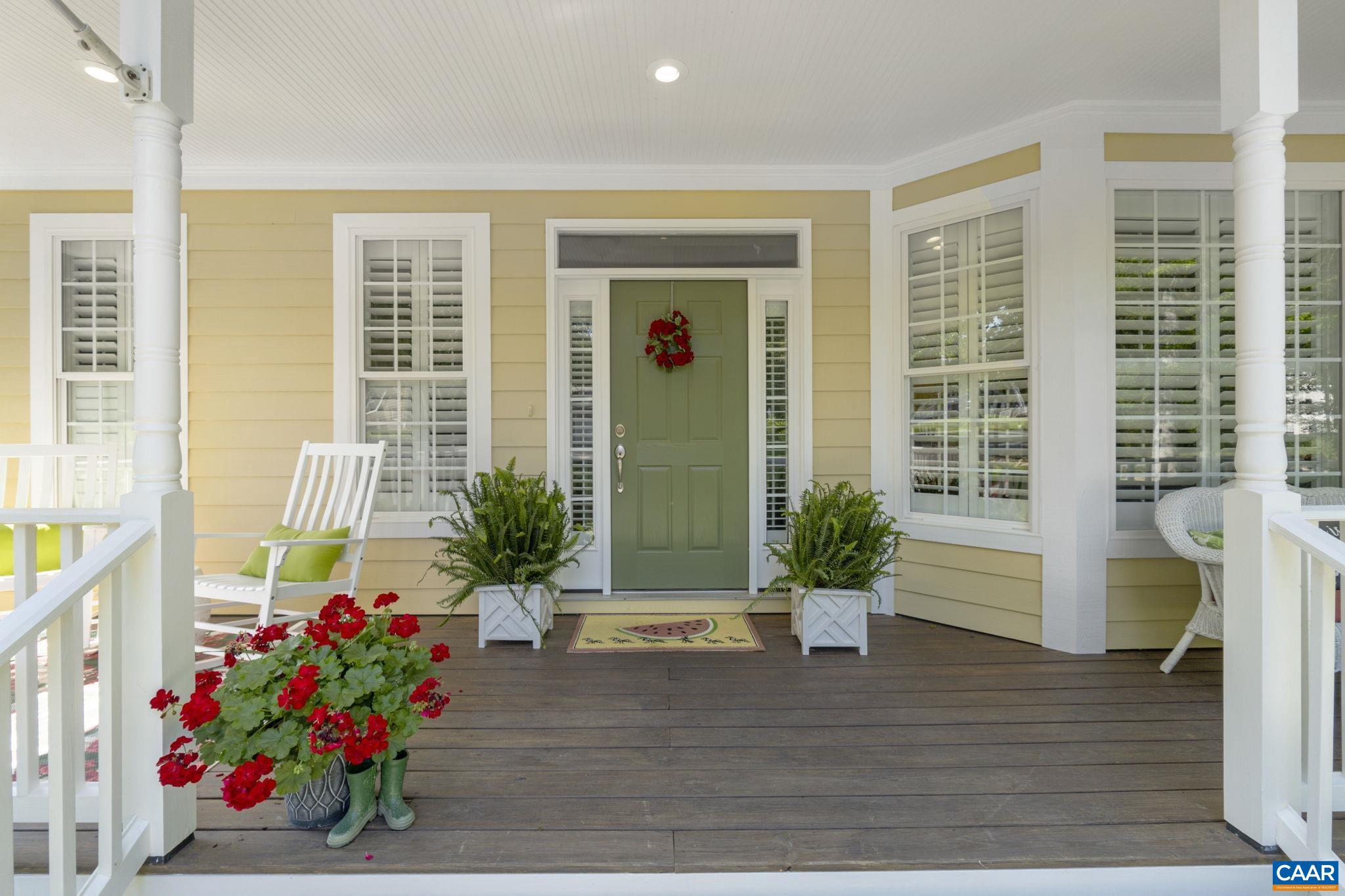 If southern living is your style, THIS home is sure to please. From the absolutely perfect front porch, to the even better screened back porch, this home exemplifies southern lake living. Meticulously maintained, this hardi-plank sided beauty has curb appeal that never ends.The perfectly manicured yard leads to an inviting front porch.Inside, each and every window is adorned with plantation shutters. In the foyer, you are treated to an extraordinary interior rarely found in homes at this price. Hardwood floors flow from the foyer, into the formal dining and living areas featuring 9?ceilings. The Kitchen is open with plenty of counter space, storage and breakfast nook. Main level laundry leads to the spacious garage. Upstairs features a beautiful Primary with spa like en-suite. 2 more spacious bedrooms and huge bonus room. Terrace level adds a large family room, full bath and 4th bedroom. Outside living includes a large screened porch and attached deck for additional entertaining. If you're looking for something above average with exquisite curb appeal, and an interior to match, look no further.,Granite Counter,White Cabinets,Fireplace in Living Room