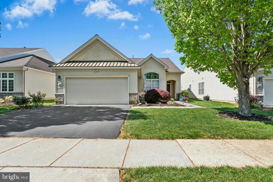 Welcome to luxury living in the highly desirable Active Adult 55+ community of Heritage Creek Estates! This beautifully upgraded single-level home offers an open and elegant floor plan ideal for both comfortable living and stylish entertaining. The charming covered front portico invites you inside, where you’ll find formal living and dining rooms perfect for hosting. The chef’s kitchen is well-equipped with ample cabinetry, a brand-new stainless steel refrigerator, gas cooktop, built-in microwave, solid surface countertops, tile backsplash, breakfast/serving bar, and a pantry. The sunlit breakfast room opens to the expansive rear outdoor living area, while the adjacent family room provides a cozy space to relax. A dedicated office/den with French doors, transom windows, built-in shelving, and serene front garden views makes working from home a pleasure. The spacious primary suite boasts dual closets—including a large walk-in—and a luxurious tiled en-suite bath with dual granite vanities, a separate shower, and a jetted Jacuzzi soaking tub. A second bedroom, full tiled bath, and laundry room with added cabinetry complete the interior. Additional highlights include a two-car garage, double-width driveway, and a beautifully designed backyard oasis with a large deck, patio, and remote-controlled awning.  This is a well maintained home including a new roof in 2024, new refrigerator (approx 1 yr) and a new hot water heater.  Enjoy an exceptional lifestyle with Heritage Creek Estates’ resort-style amenities: ballroom with catering kitchen, library, internet lounge, craft and card rooms, billiards, state-of-the-art fitness center, indoor pool with hot tub, outdoor pool, bocce ball, shuffleboard, tennis courts, and scenic walking paths including a tranquil community pond. Don't miss the opportunity to live in this vibrant and welcoming community—schedule your tour today!