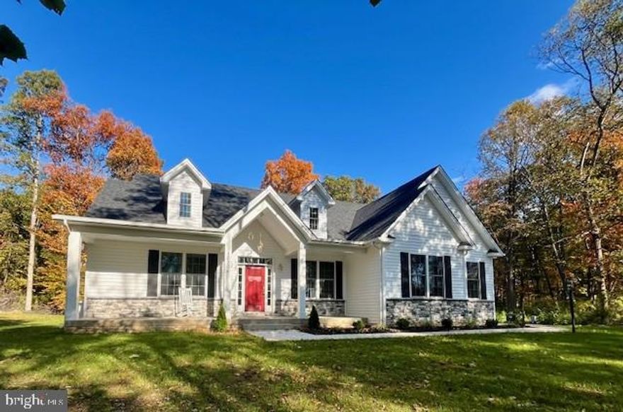 Harlow model to be built by Grossnickle Construction.  This home features an open living concept with 9' ceilings and a main-level primary bedroom.   Standard finishes include a gourmet kitchen with quartz countertops, stainless steel appliances, and a large island; solid hardwood floors in the main living areas, ceramic tile in the bathrooms, laundry, and mudroom; Moen plumbing fixtures; and a frameless shower door in the primary bathroom.   You'll work directly with John Grossnickle and Jenn B. to customize this house to suit your desires, make revisions, or even choose a different flooplan.  

The Lot is wooded but offers wonderful views to the Catoctin Mountains approx. 16 miles away.   No HOA, no covenants, no forest conservation easement.   The tax record lists an incorrect lot size - the Property is 1.82 acres in size as shown on the survey plat posted in documents.   The topography is genlty sloping and is ideal for a walkout basement.

A dirt trail from Parsonage Lane crosses the Property.  PLEASE DON'T BLOCK THIS TRAIL - it currently provides access to a neighbor's house.   A new driveway is being built to the neighbor's house and the existing trail will be closed before the summer.   You can park on the left side of Parsonage Lane near the pile of millings and walk down the trail to see the lot.   Before visiting the lot, please call listing agent  for more detailed directions