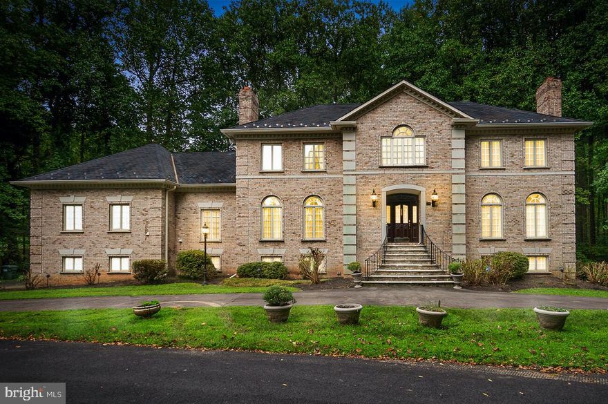 Price recently reduced!!!   Welcome home to 714 Live Oak Drive located in the established neighborhood of Eagle Rock in beautiful McLean! You will not want to miss this well-maintained, traditional home w/ lovely curb appeal, on a private wooded drive, featuring a 1.25 acre lot and incredible wooded views. Just 15 minutes from Georgetown and one light from 495, with easy access to Tysons, Bethesda, the GW Pkwy and downtown DC, this house is a commuter’s dream location! Nature lover? Scott’s Run Preserve is practically in your backyard with trails that will take you to the Potomac River. Langley Pool is also walkable and a great place for kids to take part in swim team and families to meet and enjoy time together in summer. This 5BR/6BA home includes a wooded yard, spacious deck & patio with an expansive basement with bar, movie room and high ceilings - an entertainer's dream! The huge multi-purpose “studio” is great for family time and includes a spiral staircase to a loft area with skylight. Crown molding, flawless hardwood floors and elegant finishes are found throughout. As you enter this home, you are greeted by a two-story foyer with marble floors and a dramatic sweeping staircase. The foyer leads you into the formal dining room and living room which both feature elegant fireplaces. The gourmet kitchen is complete with stainless steel appliances, granite counters, a large kitchen island, double ovens and a breakfast area! A built-in desk and additional cabinets/countertop space compliment this spacious kitchen. The family room features a wall of windows and an impressive stone fireplace that adjoins to a lovely sunroom, which can be used as a meditation room, homework room or even office. A private home office with built in shelving is tucked away for privacy, as is another office in the basement. Four spacious bedrooms occupy the upper level, each with their own en-suite baths and spacious closets. The exquisite master suite has a cozy fireplace and dressing room with private access to the studio and walk-in closets. The master bath is complete with dual vanities, a jetted spa tub, and a separate shower. On the lower level of the home, do not miss the home theater, home gym, luxurious sauna and wine cellar. Also on the lower level is a second family room with fireplace, bedroom and full bath, game/media room, kitchen with bar seating and the second home office space. Other features of the home include a 3 car garage, 2 HVAC systems with humidifier and air filtration, two hot water heaters, and a BONUS plot of land (approx. 1/4 acre) across the road on the front side of the home with many possibilities. Conveniently located close to Churchill Road Elementary, Cooper Middle, and Langley High School, this meticulously maintained home is move-in ready and filled with so many beautiful spaces that you  and your family can make your own!